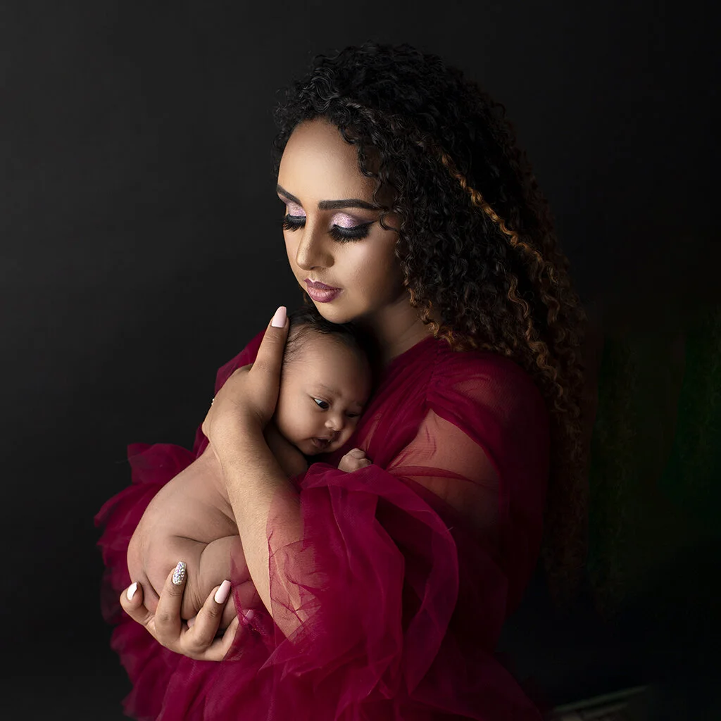 mom and newborn pose.jpg