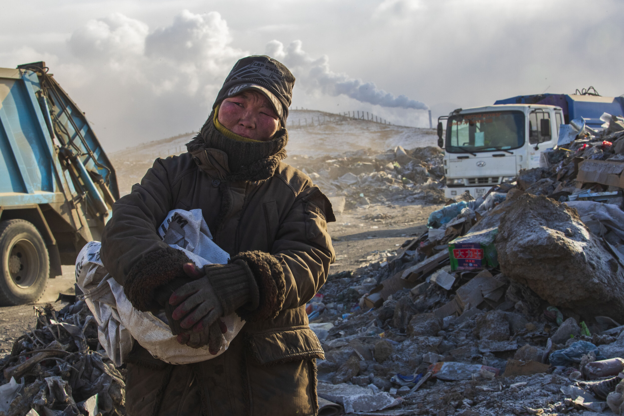  A garbage picker, who wished not to be named, poses for a portrait at an unnamed landfill on Friday, December 21, 2018, in Ulaanbaatar, Mongolia. "My regular income is normally 5,000 Turkig a day 10,000 on a good day.” (2500 is equal to 1 USD)," the