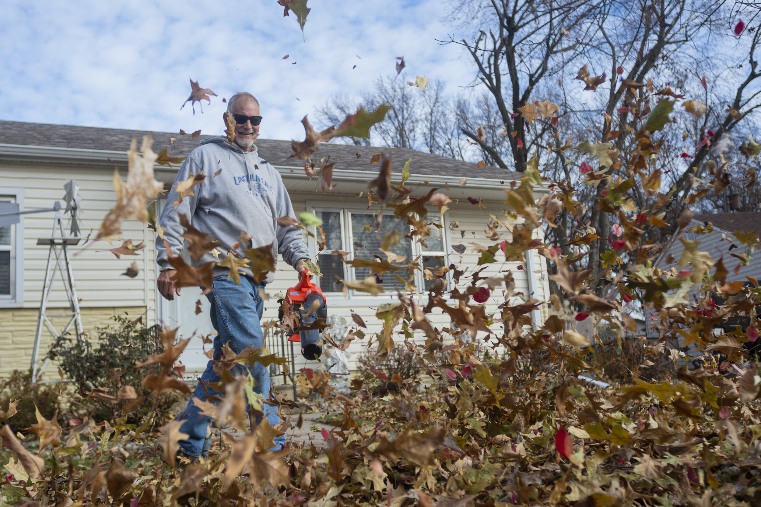  Jerry McDonald uses a leaf blower to clear derbies from his rental property on Sunday, November 15, 2020, in Lincoln, Nebraska. KENNETH FERRIERA, Journal Star. 