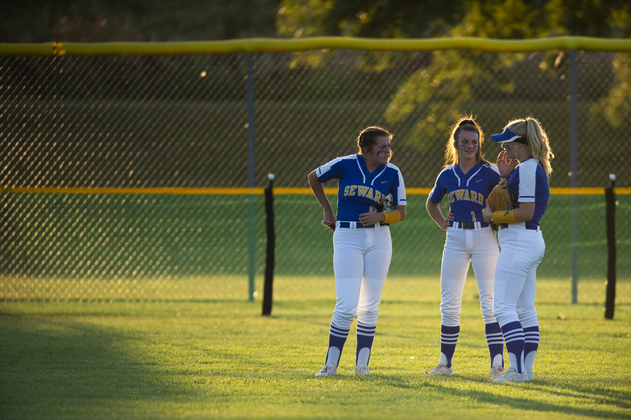  Seward outfielders mingle during a timeout during their match against Norris at Plum Creek Park on Thursday, 9 03, 2020, in Seward, Nebraska. 