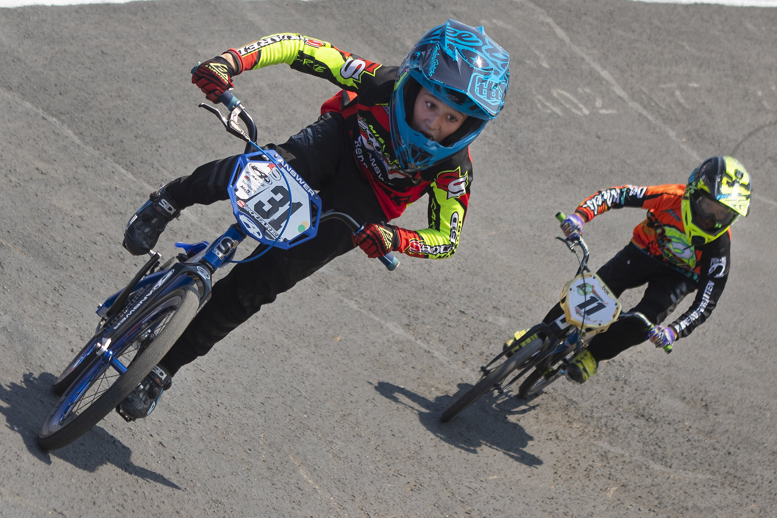  Logun Meyer (left)  and Jenson Koll race around the corner of the Star City BMX track during the 13 intermediate race at the BMX Cornhusker Nationals event on Sunday, August 23, 2020, in Lincoln, Nebraska. KENNETH FERRIERA, Journal Star.  