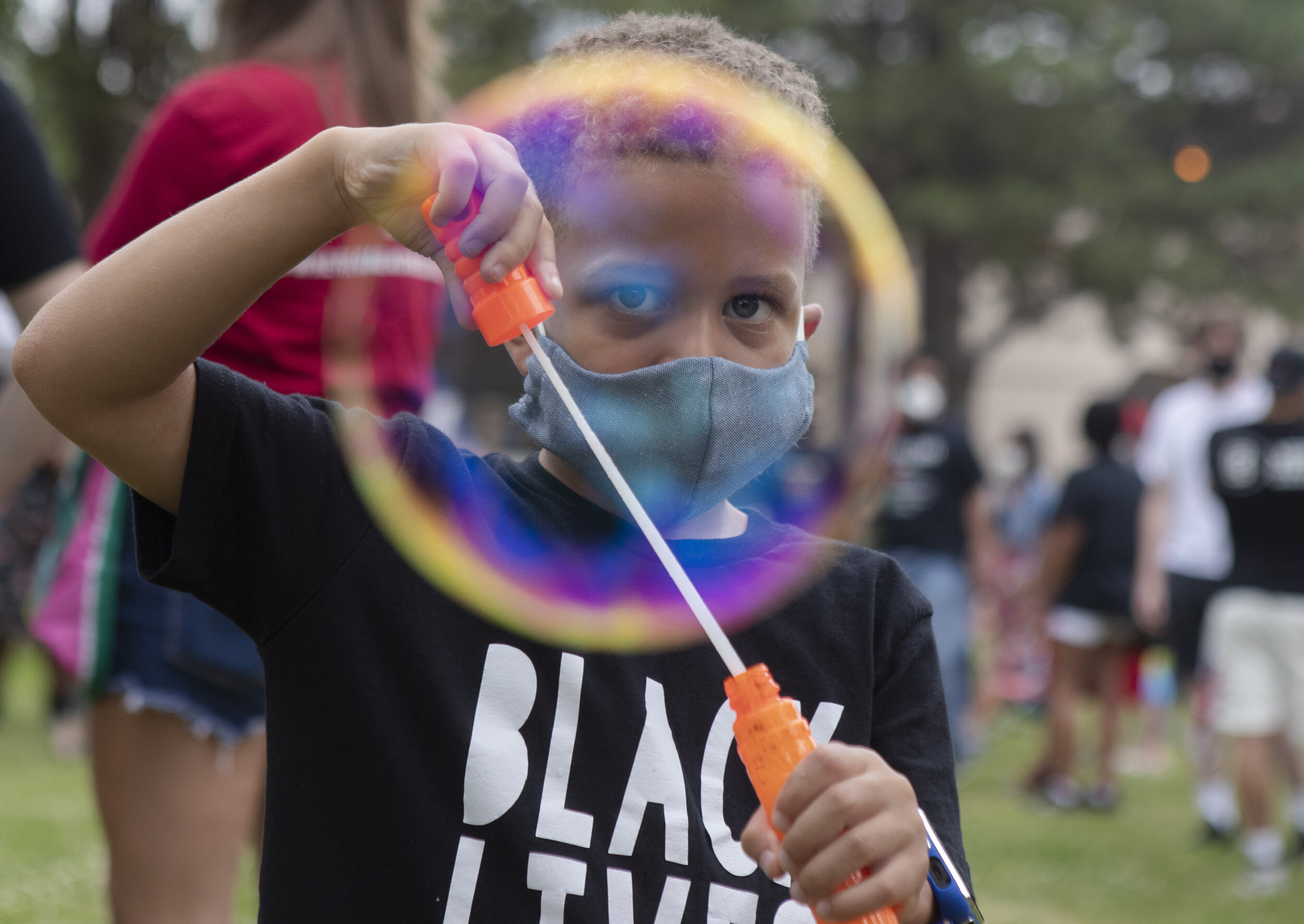  Charleston Okosun creates a swath of bubbles using a bubble wand he was given during the Juneteenth celebration at the Indian Center on Friday, June 19, 2020. KENNETH FERRIERA, Journal Star. 