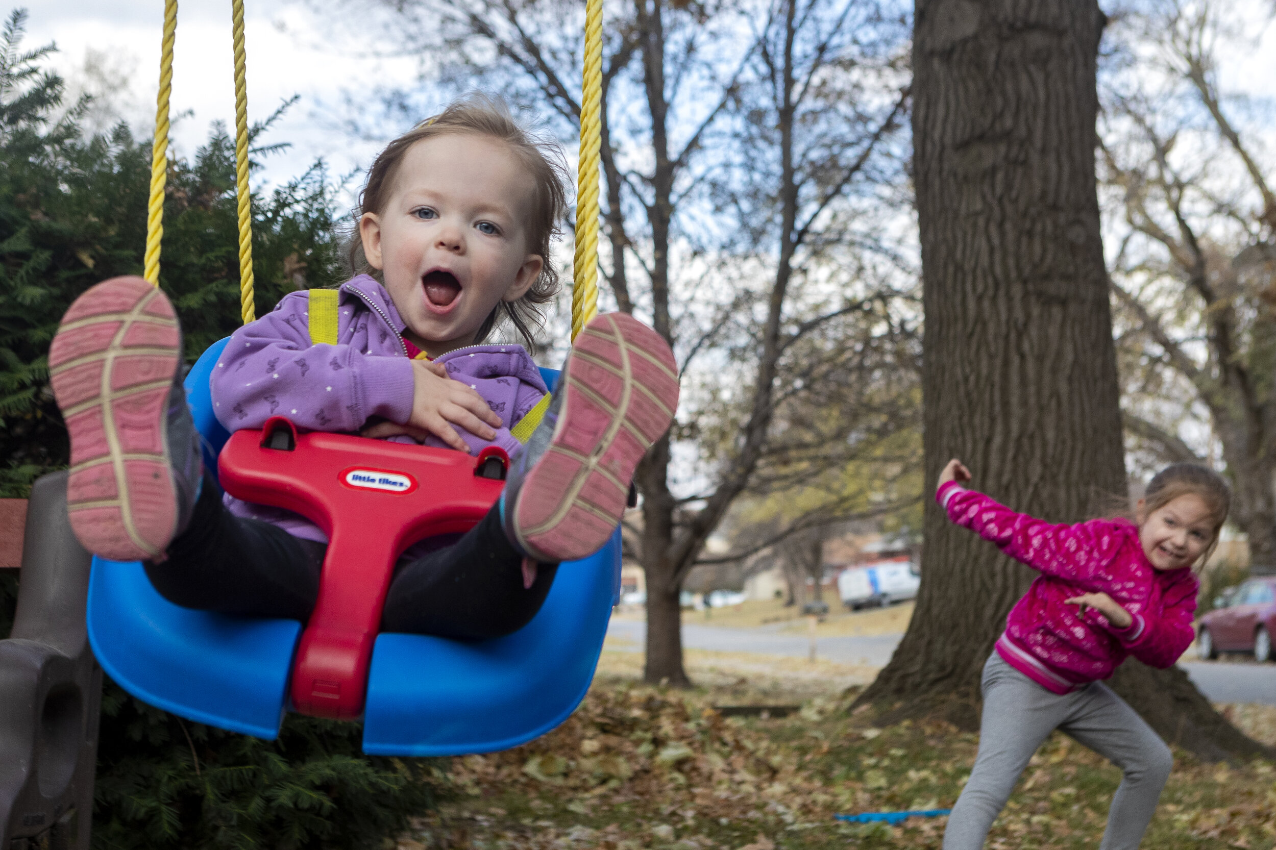  Lea Ehly (left) swings high after getting a push from her sister Alexis Ehly while they take a break from raking leaves with their family outside their Lincoln home on Sunday, November 08, 2020, in Lincoln , Nebraska. KENNETH FERRIERA, Journal Star.