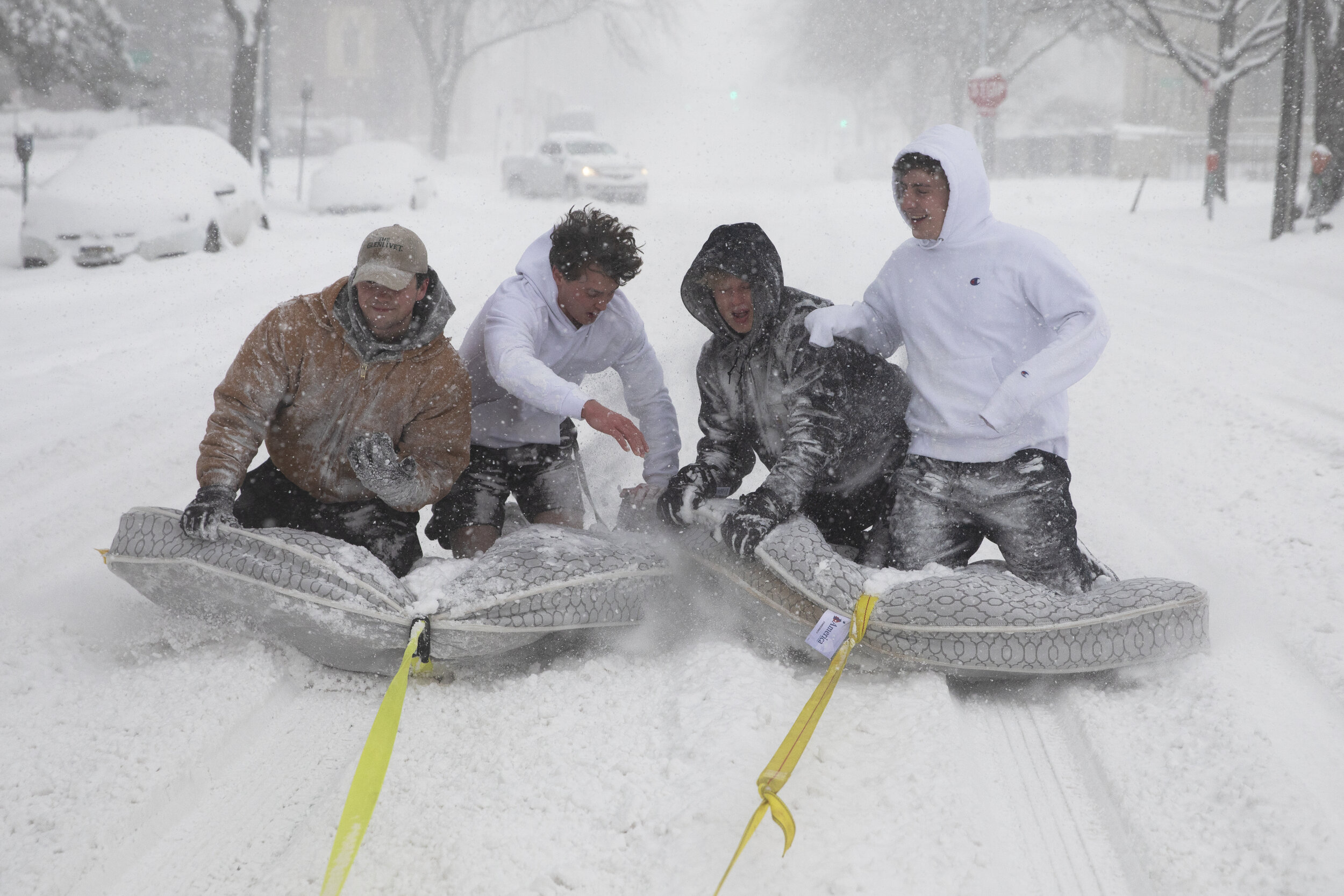  Brothers of the Phi Gamma Delta Fraternity use a pickup truck to pull their friends on mattresses through UNL’s campus during a winter storm in downtown Lincoln on Monday, January 25, 2021. The National Weather Service called it "historic" and "the 