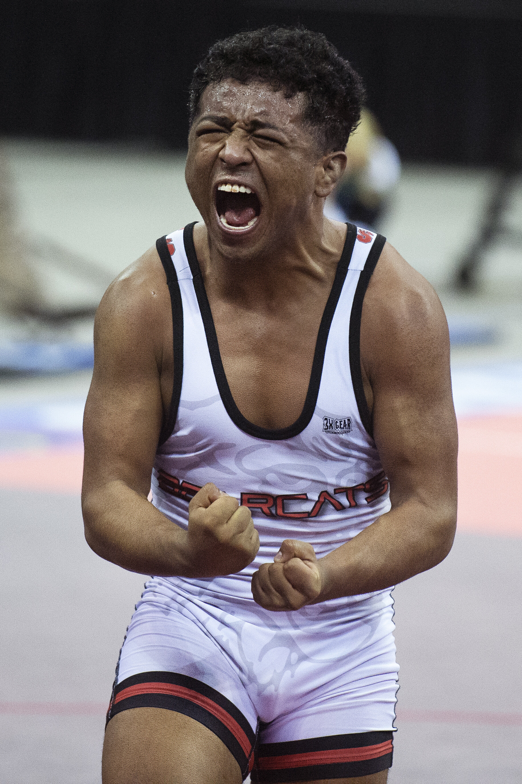  Scottsbluff’s Paul Garcia celebrates after defeating Gering’s Paul Ruff in the Class B 126 pound state championship match on February 20, 2021, in Omaha, Nebraska. At the sound of the whistle, Garcia let loose a yell. He had just entered the hallowe