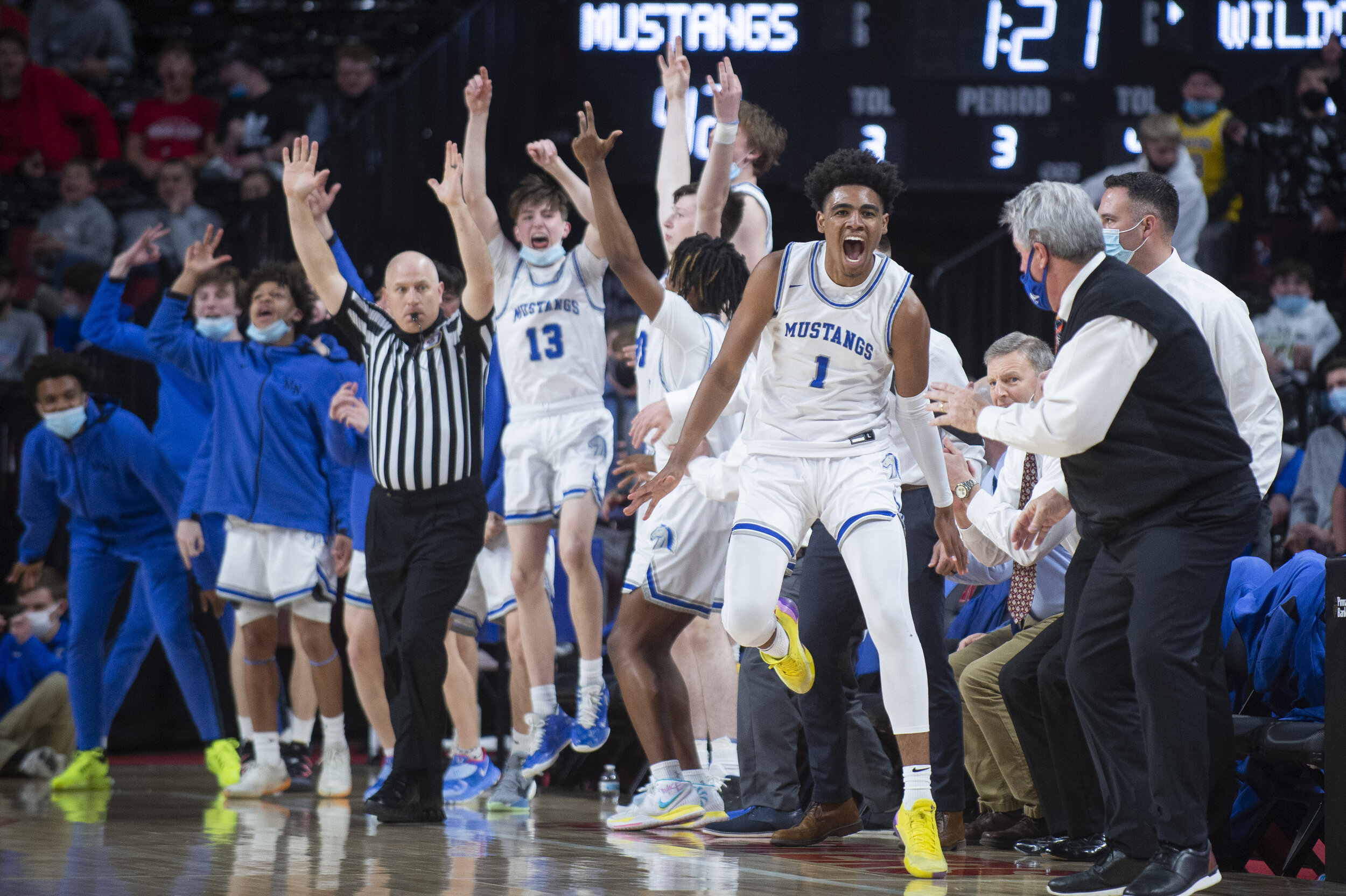  Millard North's Saint Thomas (1) dances down the sideline after hitting yet another three-point shot in the third quarter during a class A semifinal, Friday, March 12, 2021, at Pinnacle Bank Arena. KENNETH FERRIERA, Journal Star 