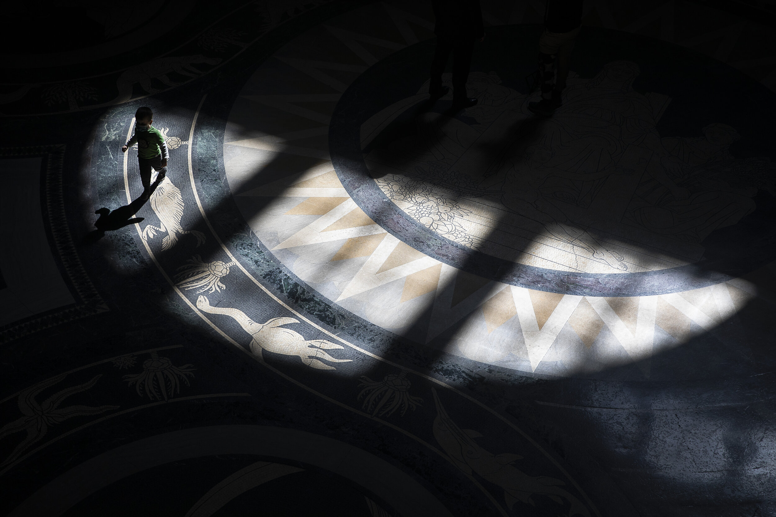 Three-year-old Quentin Deardden passes through a swath of light as he tours the inside of the Capitol rotunda with his family at the Nebraska State Capitol on Wednesday, March 10, 2021. KENNETH FERRIERA, Journal Star 