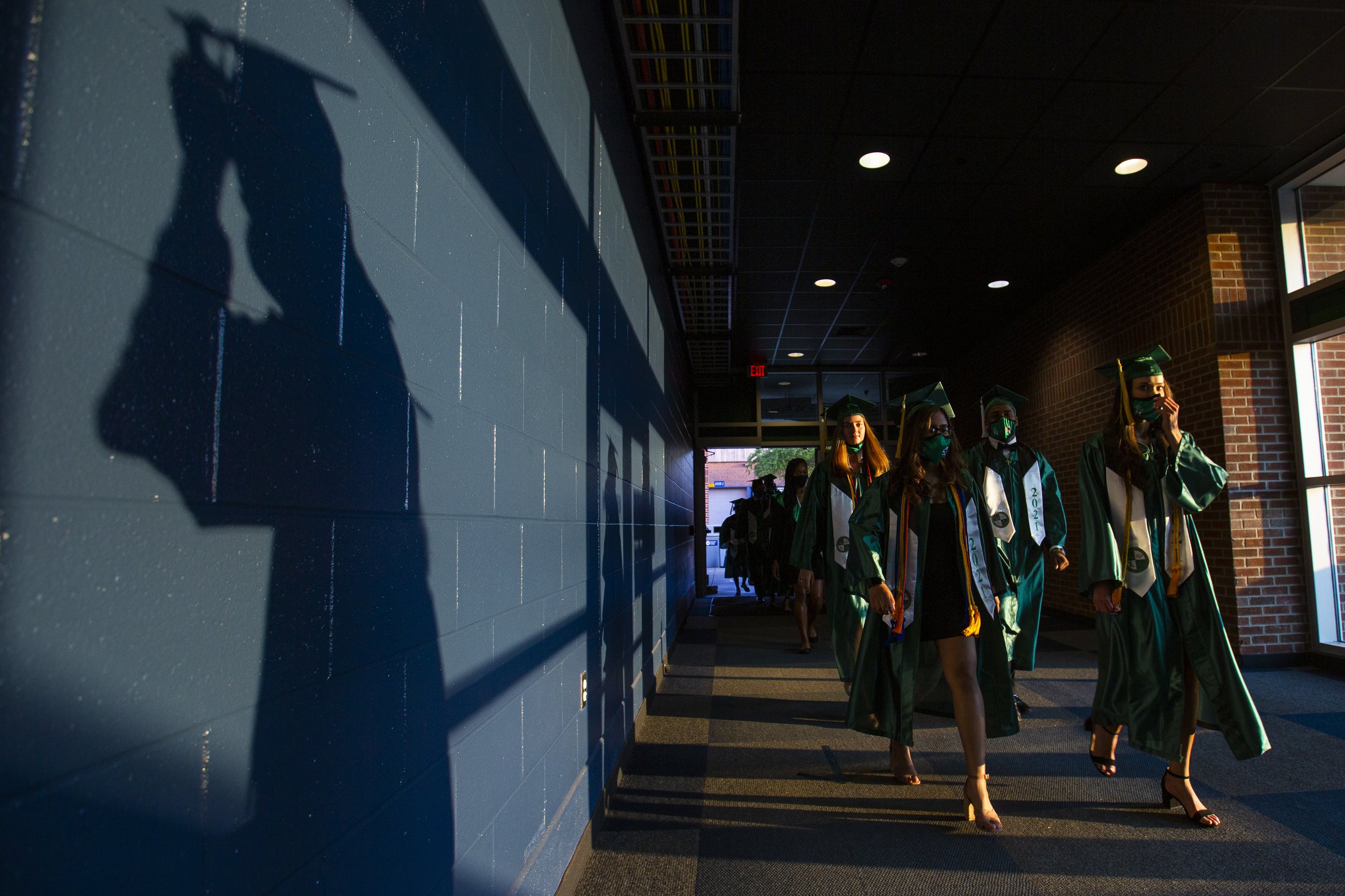  Southwest High School graduating seniors make their way into the Greensboro Coliseum for graduation a graduation ceremony in Greensboro, N.C., on Saturday, June 5, 2021.  