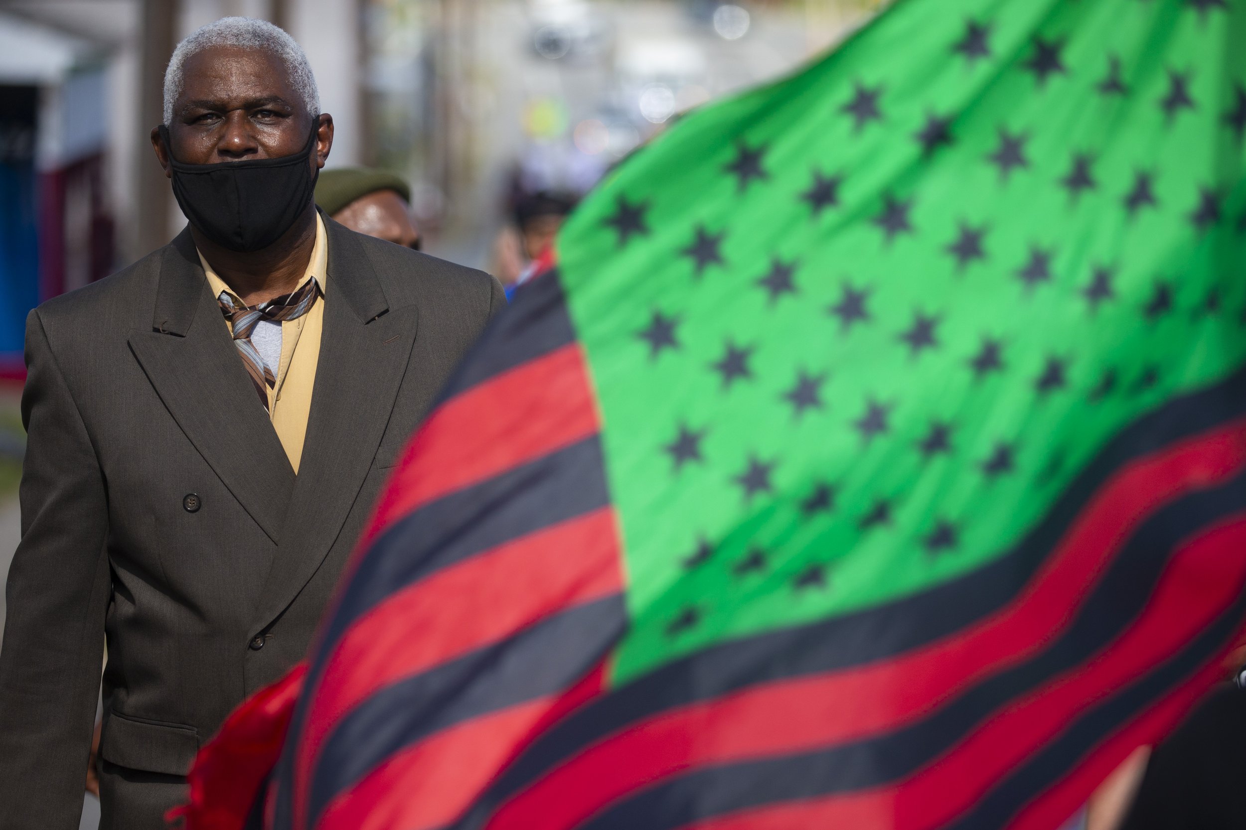  A protester marches through the streets of High Point during the No Justice No Peace March on High Point in High Point , N.C., on Saturday, June 26, 2021. The march, which started at the High Point City Hall, was attended by hundreds of protesters. 