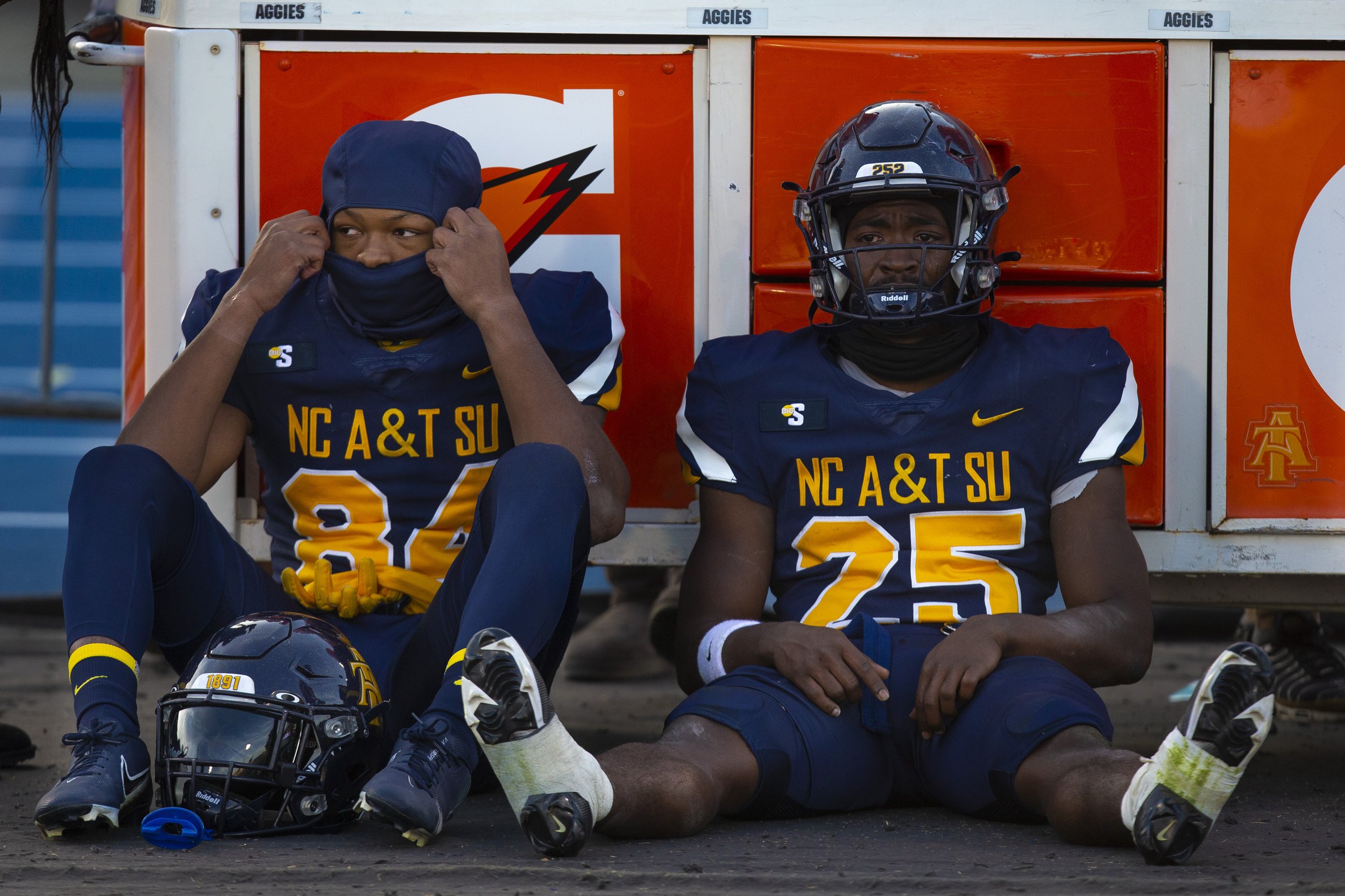  A&amp;T's Jamison Warren (left) sits besides his teammate Kashon Baker as he becomes emotional after A&amp;T lost to Gardner-Webb  at BB&amp;T Stadium in Greensboro, N.C., on Saturday,  November 20, 2021.   