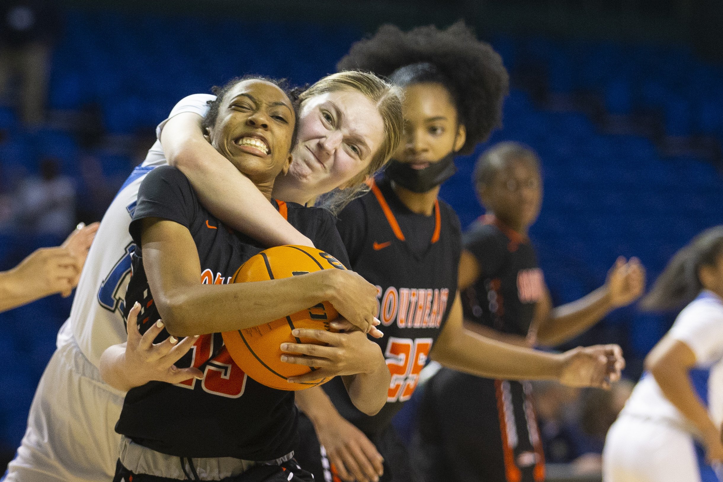  Ragsdale's Erin Mackie fouls Southeast's Kailey Gates while battling for the ball during the third quarter on the second day of the HAECOisHiring.com Invitational at the Greensboro Coliseum - Special Events Center in Greensboro, N.C., on Tuesday, De