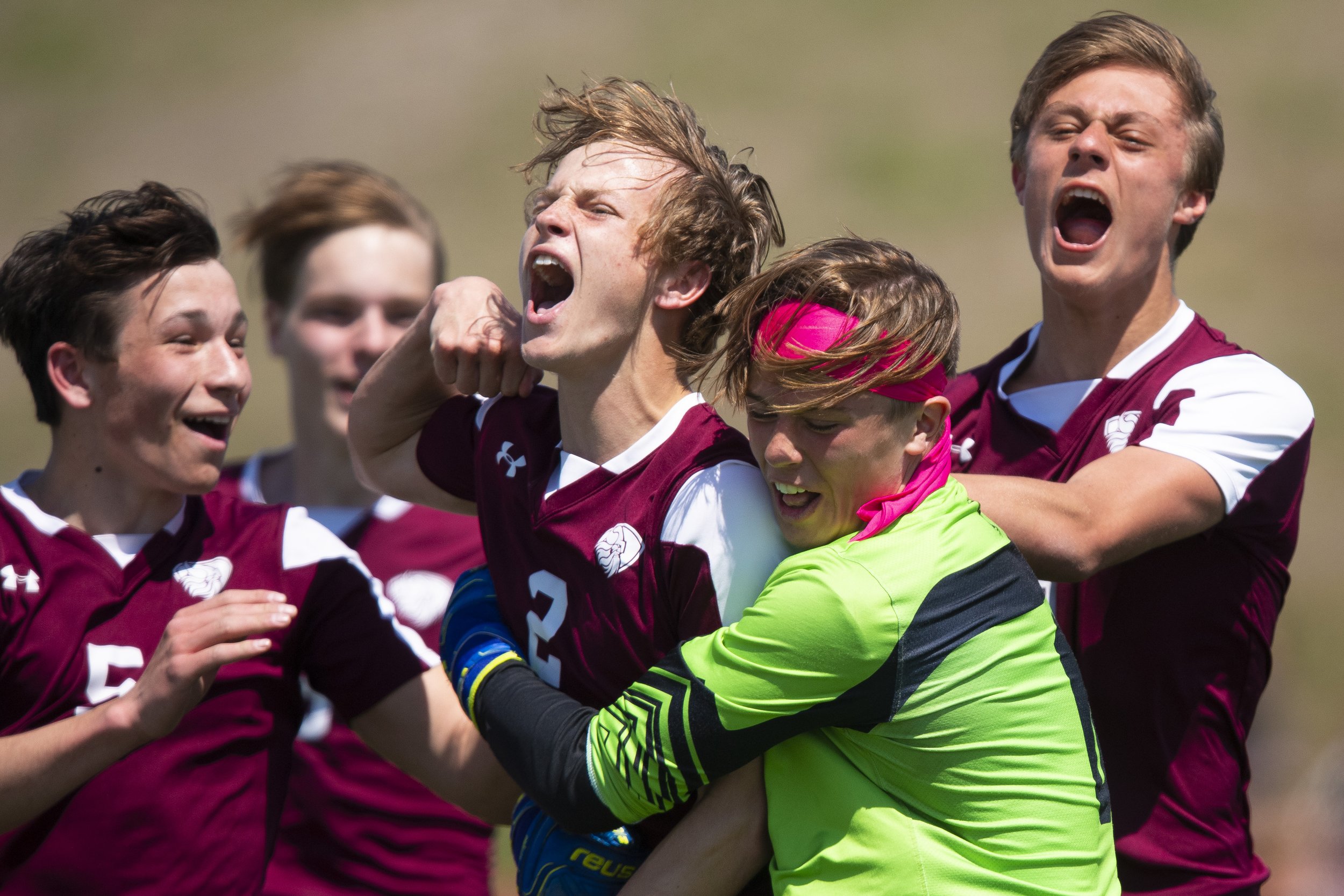  Waverly's Tyler Brewer (center) celebrates with his team after scoring in the final minutes of the second half, evening the score 1-1 against Crete during the District B-5 boys championship at Waverly High School on May 7, 2022, in Waverly, Nebraska