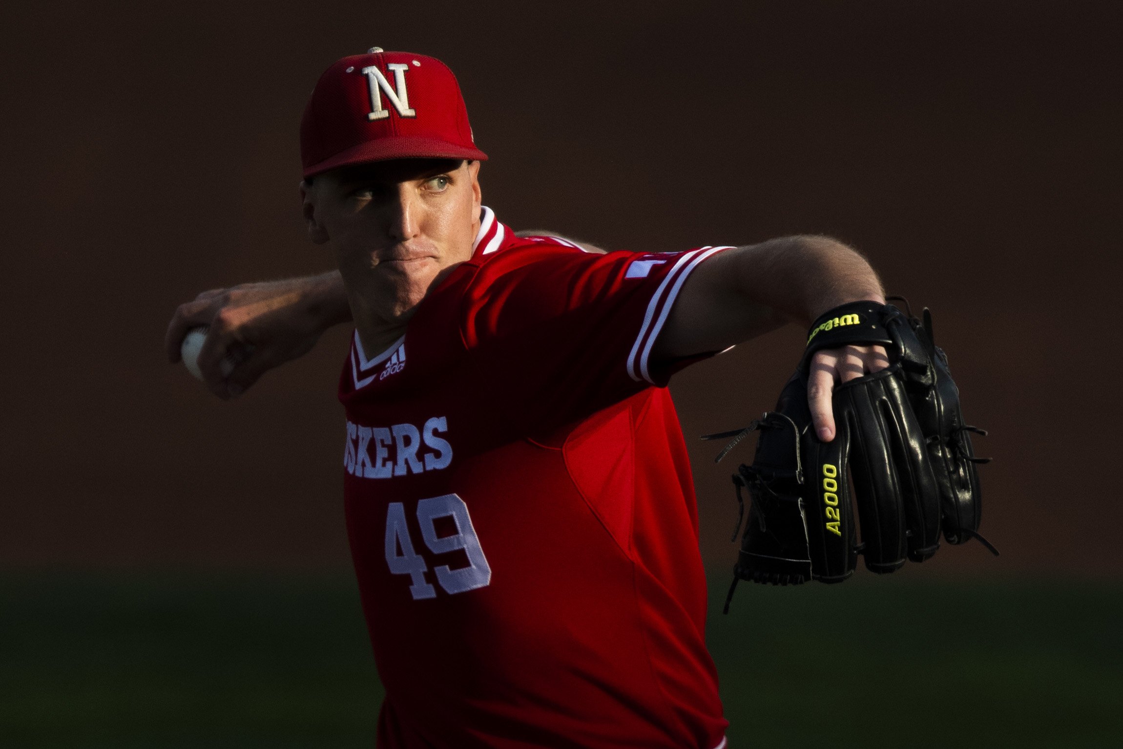  A dying ray of light catches Nebraska starting pitcher Dawson McCarville as he pitches against Omaha during the first inning at Haymarket on April 27, 2022, in Lincoln, Nebraska. KENNETH FERRIERA, Journal Star  