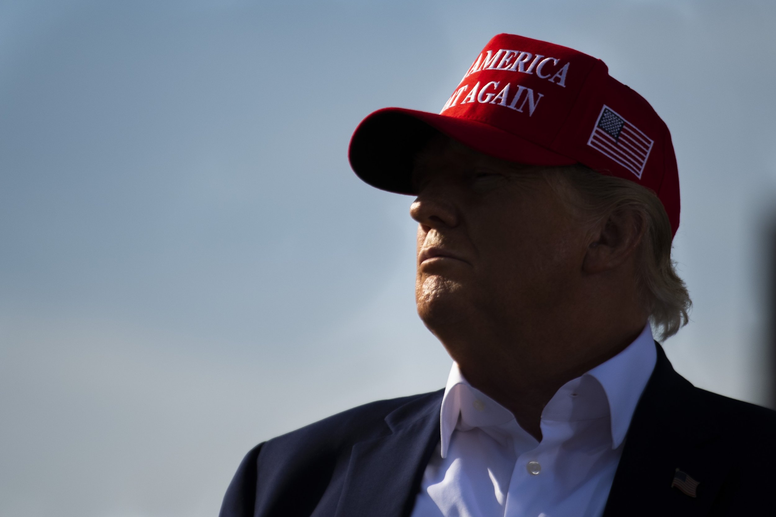  Former president Donald Trump watches as clips of President Joe Biden play, Trump would later call him 'weak', during a Trump rally for Charles Herbster at the I-80 Speedway on May 1, 2022, in Greenwood, Nebraska.  