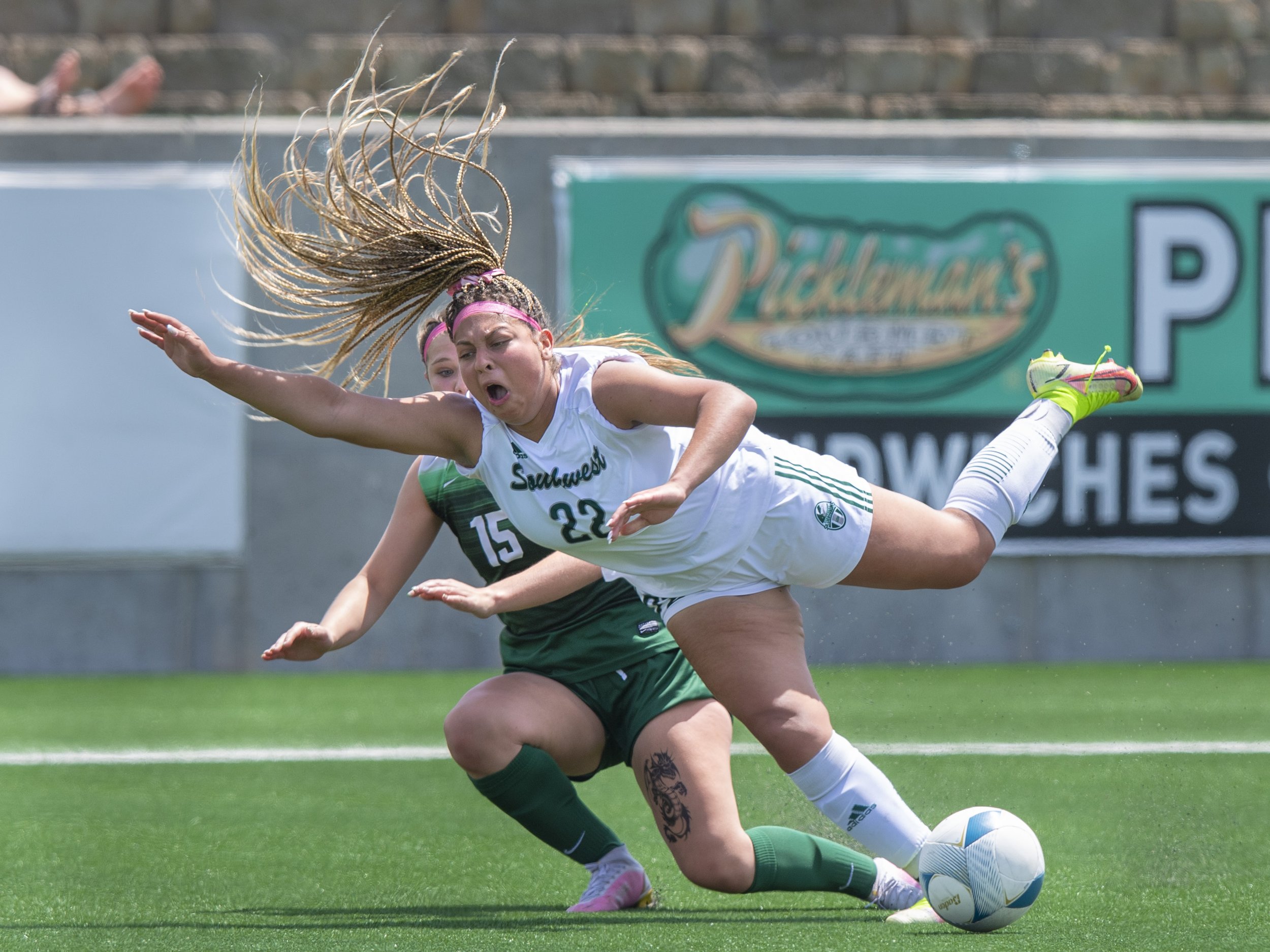  Gretna's Anna Harris (second center) collides with Lincoln Southwest's Aniya Seymore in the second half during a girls class A semifinal game at Morrison Stadium on May 13, 2022, in Lincoln, Nebraska.  