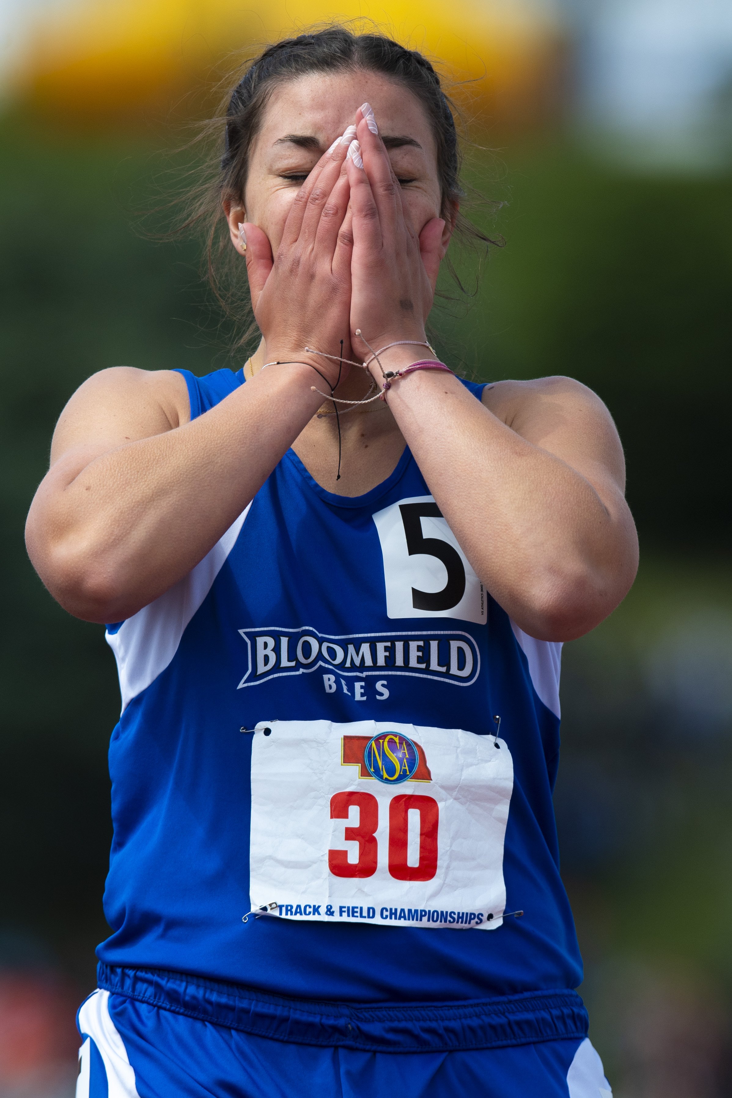  Bloomfield's Alexanddra Eisenhauer reacts after finishing ahead of North Platte's Hayley Miles (not pictured) in the Class D girls 100 meter dash during the state track championships at Burke Stadium on May 21, 2022, in Omaha, Nebraska. 