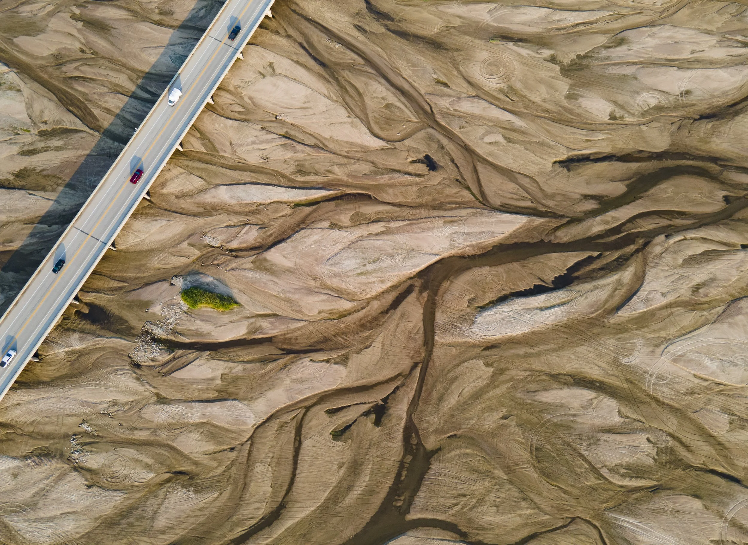 The Sand bed of the Platte River, where the Middle Channel Platte combines with the Platte River, can be seen as vehicles cross over a bridge along Highway 34, located to the Southeast of Grand Island on Friday, Sept. 8, 2023, in Grand Island.