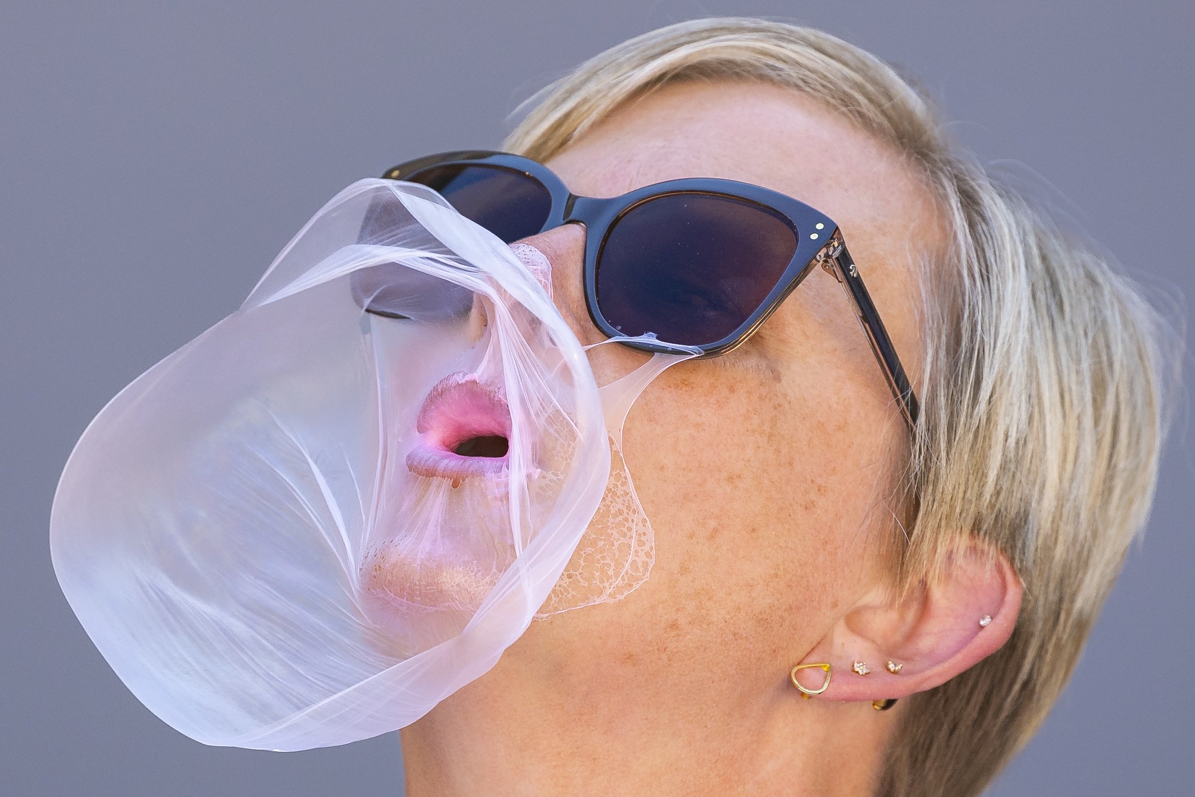  Wahoo native Bridget Dobesh's bubble gum pops while she tries to blow the biggest bubble during the state championship bubble gum blowing contest ,for the 155th annual fourth of July in the Fourth of July capitol of Nebraska, on Tuesday, July 4, 202