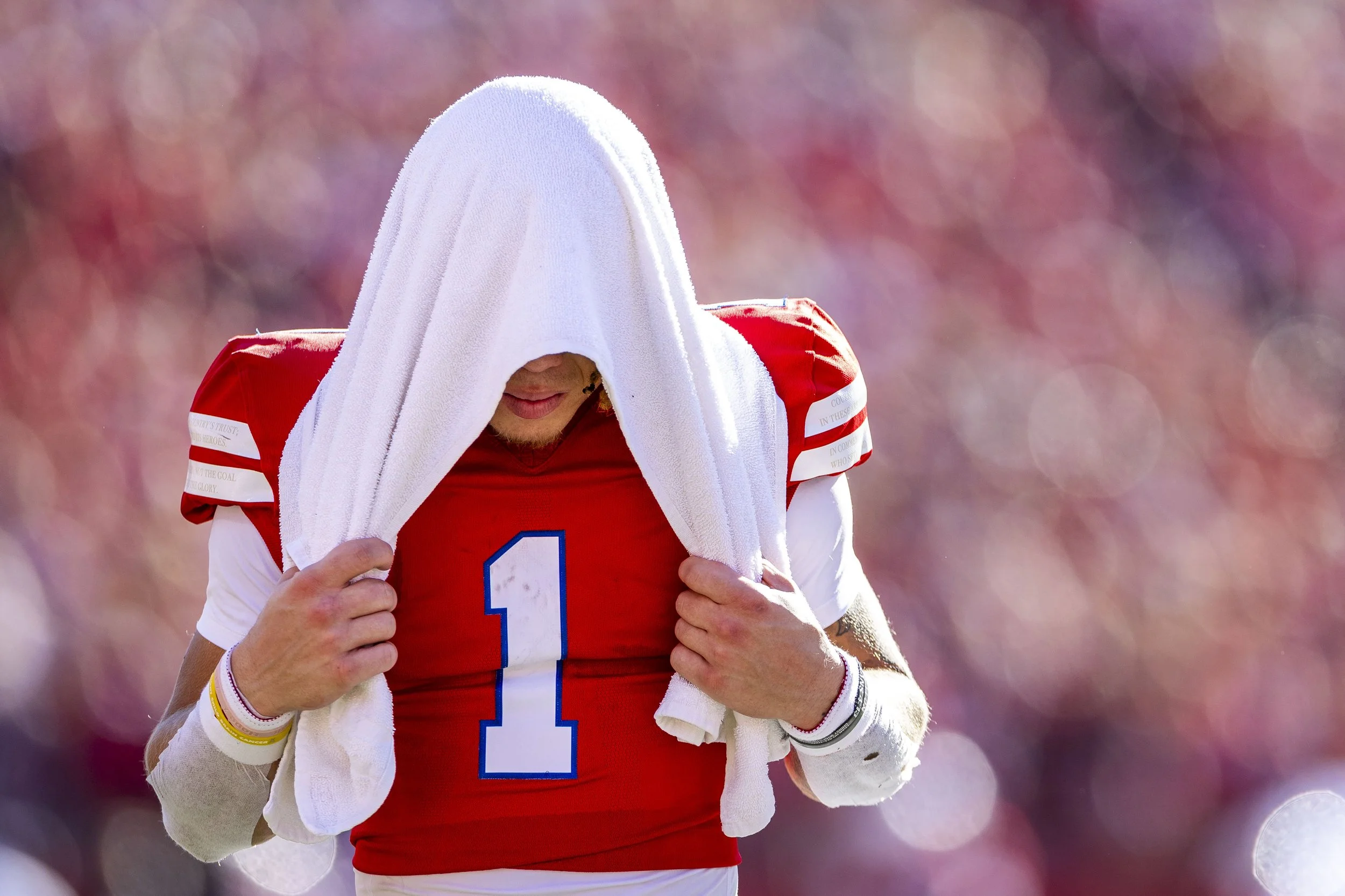 Nebraska's Billy Kemp walks off the field after appearing to suffer an injury in the second quarter against Northwestern on Saturday at Memorial Stadium.