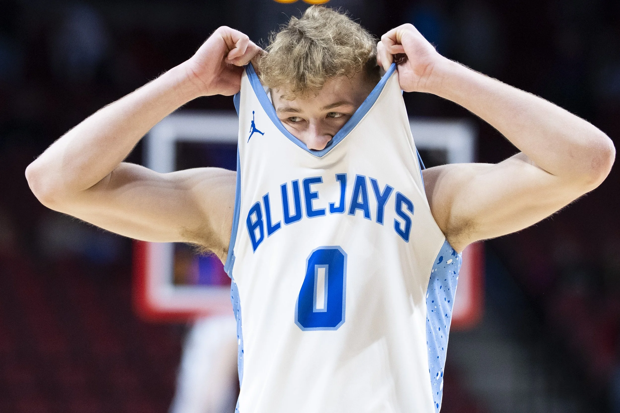  Ashland-Greenwood's Dane Jacobsen (0) pulls his jersey over face after the Bluejays fall to Auburn in a Class C-1 boys state tournament semifinal game Friday, March 8, 2024, at Pinnacle Bank Arena. 