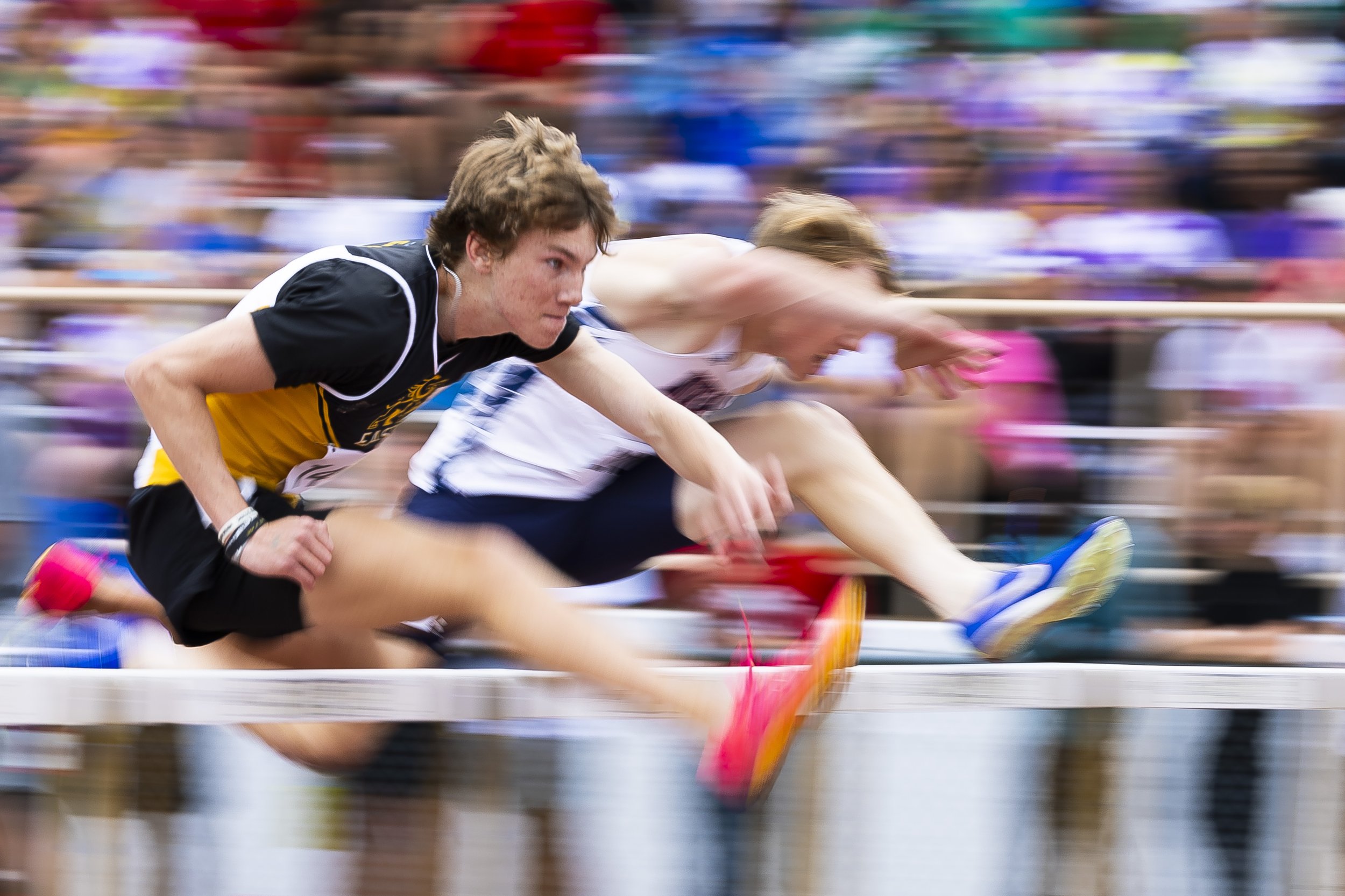  Gretna East's Thomas Smith (first left) races over hurdles beside Norris' Brady Wilkinson in the 110 high hurdles preliminary during the first day of Class A &amp; B state track at Omaha Burke Stadium on Wednesday, May 15, 2024. 