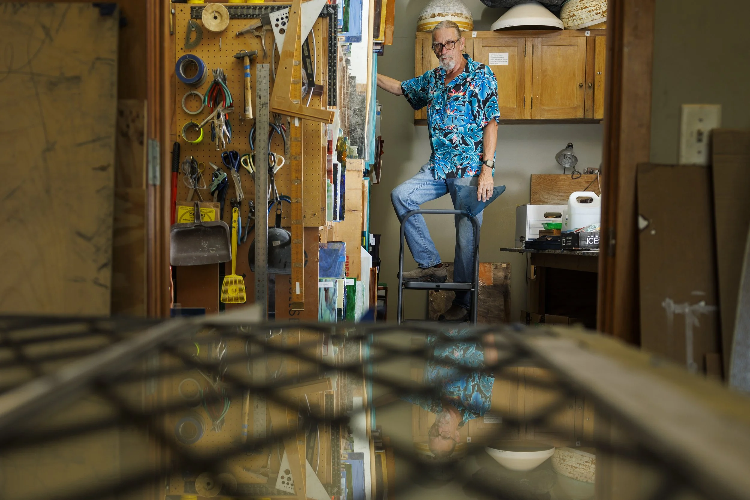  Harry Tompkin, owner of Palace Glass Co. sorts through different types of stained glass as he takes inventory and cleans out his shop with Kelly Mathes (not pictured) on Wednesday, July 31, 2024, in Lincoln.  After 43 years of creating stained glass