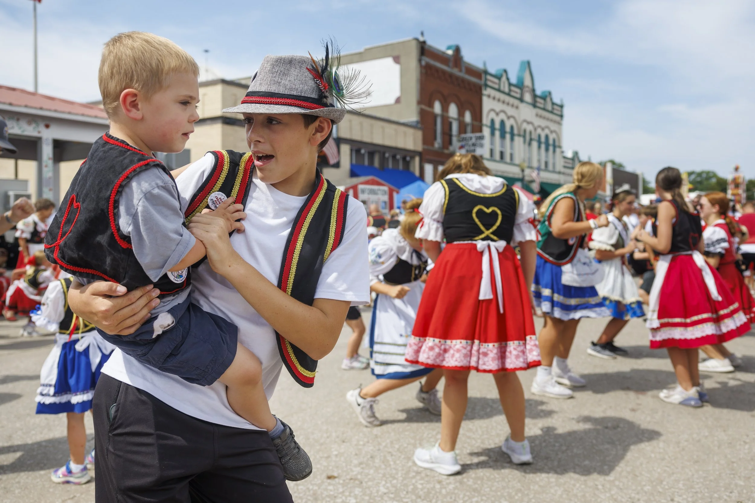  Wilber native David Rogers, 10 (first right) holds his cousin William Mays, 3, as they dance during the 63rd annual Wilber Czech Festival held in Downtown Wilber on Saturday, Aug. 3, 2024. 