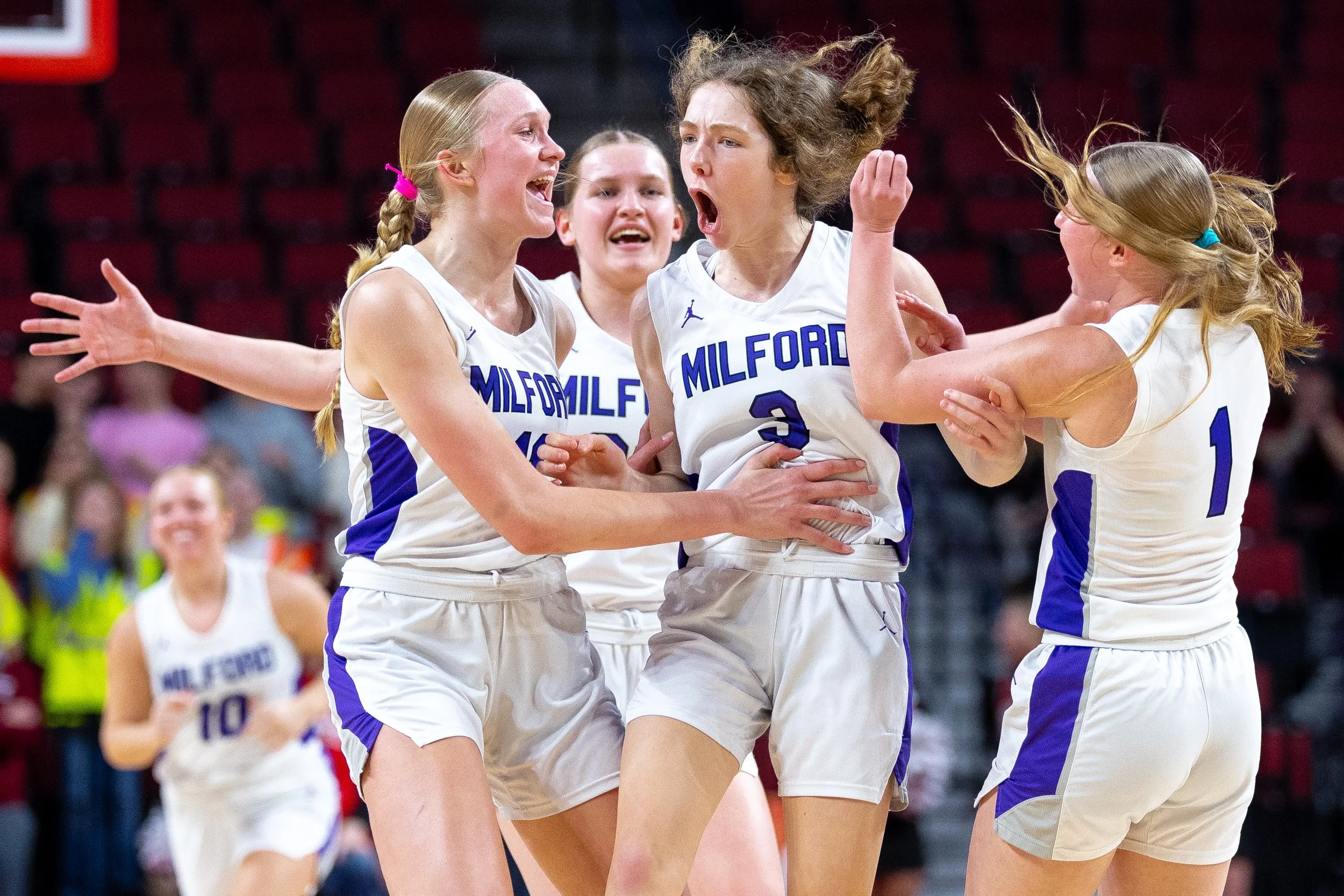  After hitting a half court buzzer beater in the first half, Milford’s Abby Crabtree (3) celebrates with her teammates as they head to the sideline during a Class C-1 semifinal state basketball tournament game on Friday, March 6, 2026, at Pinnacle Ba