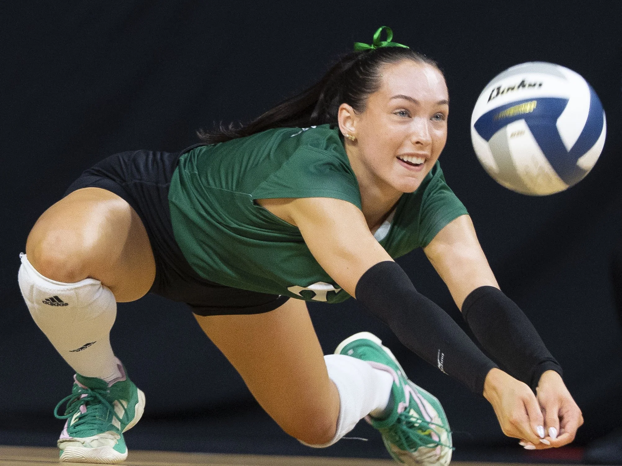 Lincoln Southwest's Shelby Harding dives to save the ball from hitting the ground in the first set during a Class A first-round match Wednesday, Nov. 20, 2024, at Pinnacle Bank Arena.