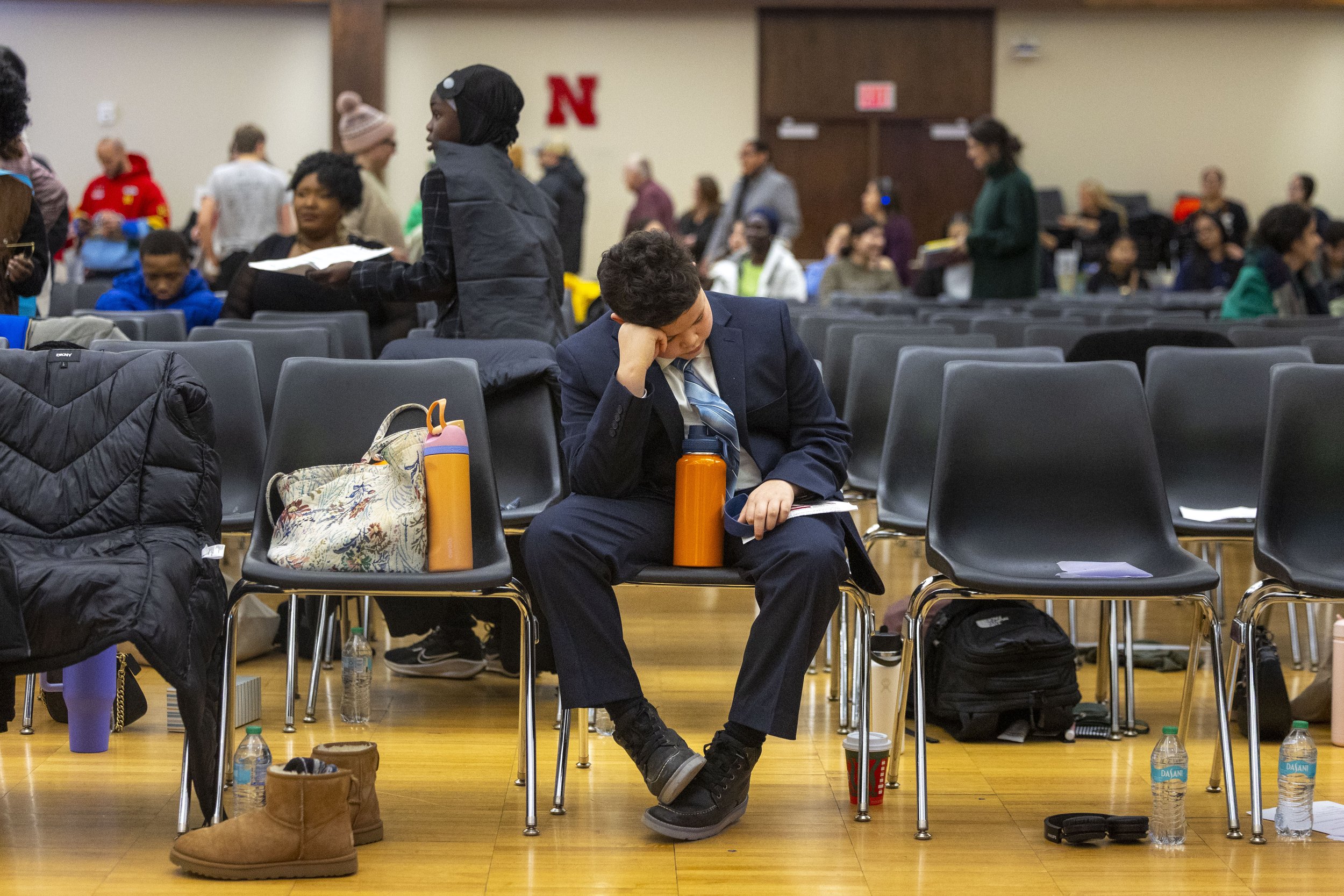 Max Graves, center, takes a moment to get some sleep before the start of the 31st Annual MLK Youth Rally held at the Centennial Room of the University of Nebraska–Lincoln Student Union  on Monday, Jan. 19, 2026, in Lincoln.

Graves' mother, Emily Koo