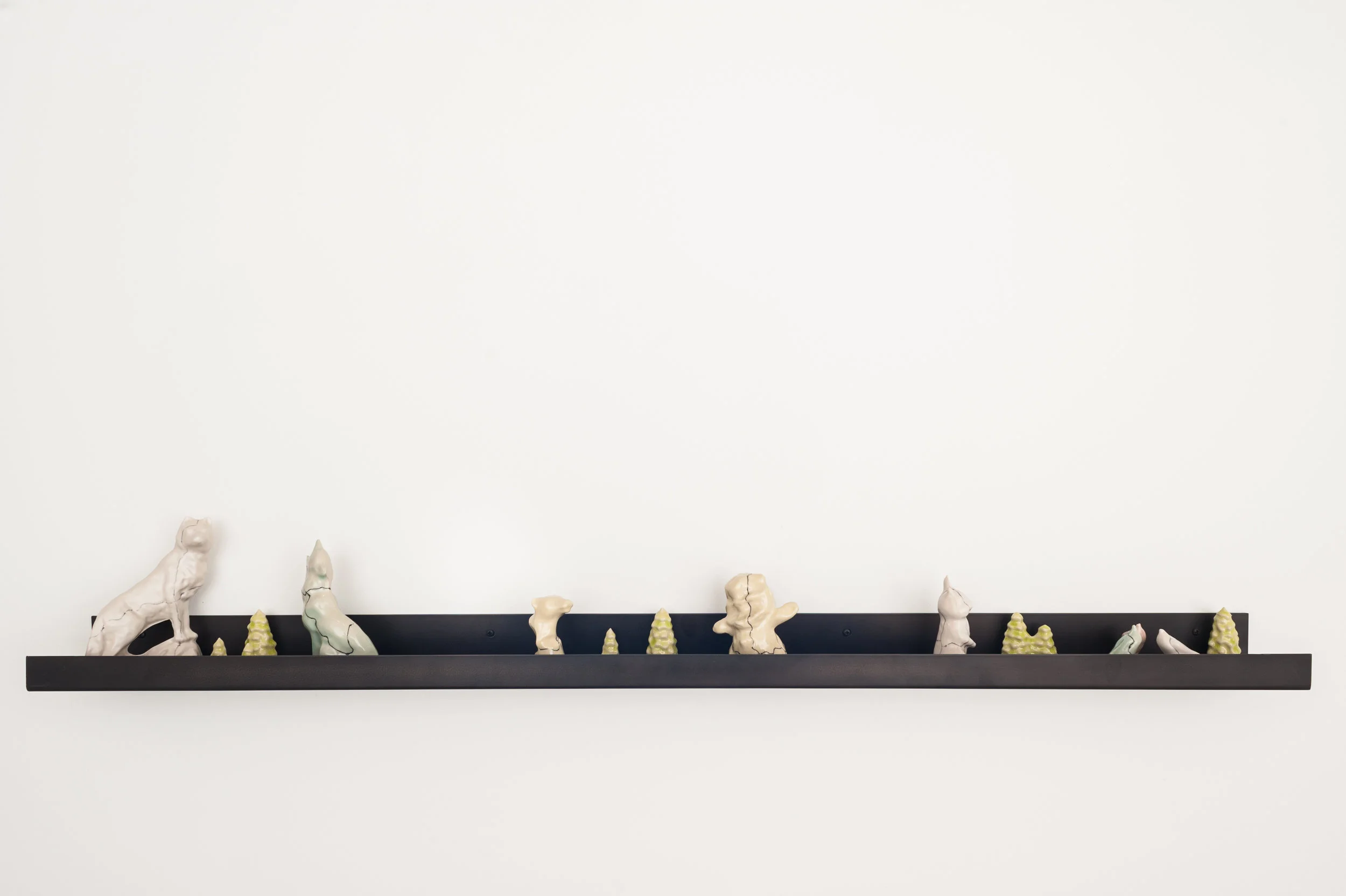 Liminal Figurines , 2013, slipcast porcelain, glaze, metal shelf.