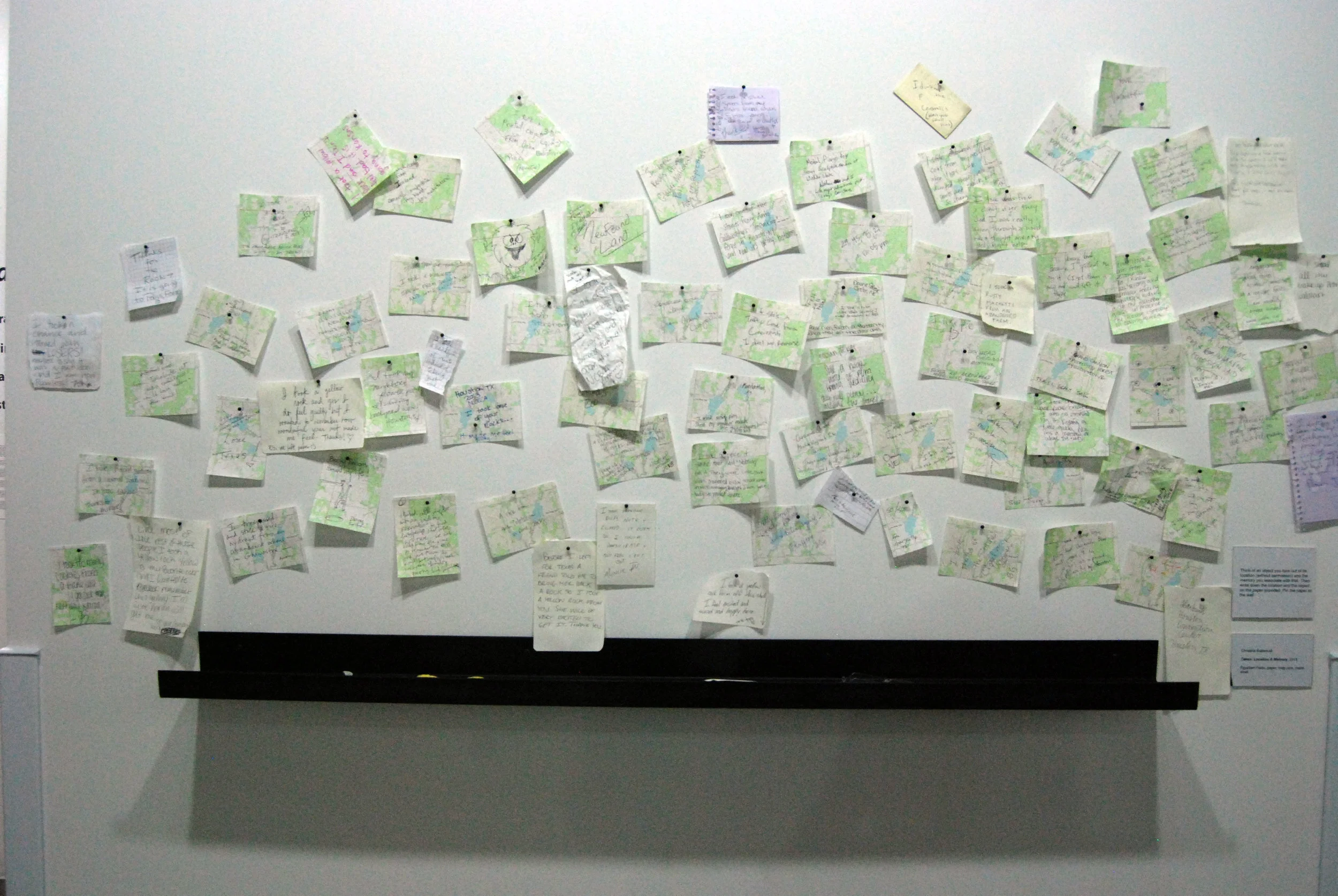 Taken: Location & Memory, 2013, Egyptian paste, paper, map pins, metal shelf.