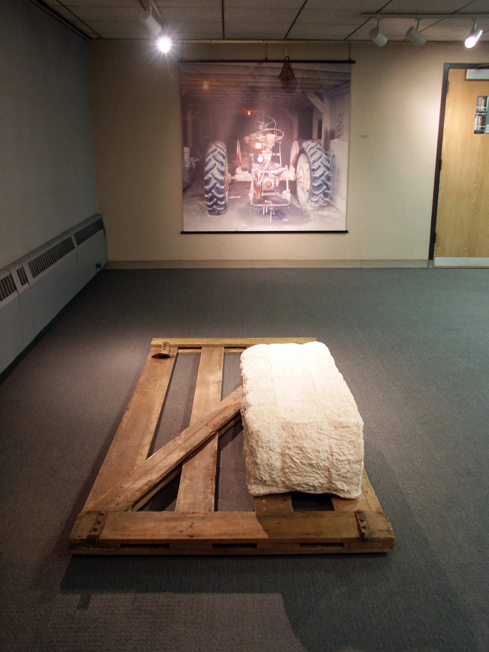 The Old Case with Pulley and Hay Bale with Gate , 2007, digital print on polyester paper, unfired clay, wooden gate, pulley.