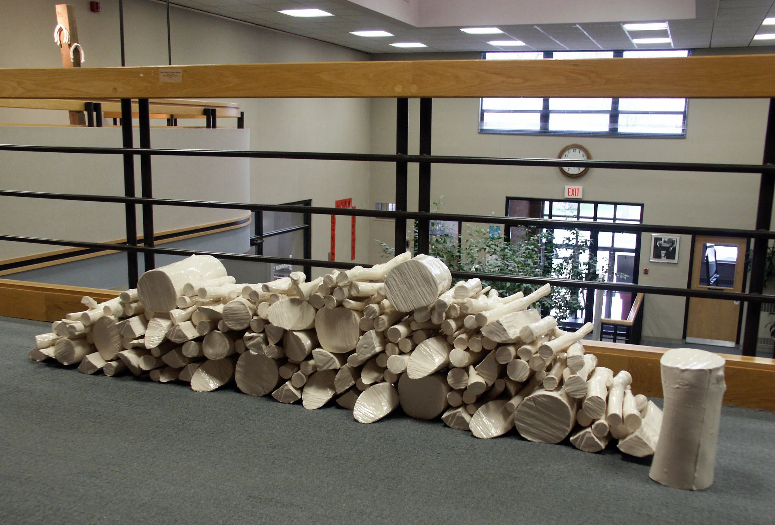 Rack of Logs , 2007, slipcast porcelain, glaze. The original logs were casted from the orchard on the farm.