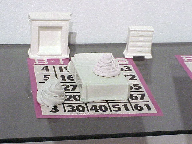 Frosting Furniture Series, 2000, Slipcast porcelain, glaze, bingo card, and glass shelf.