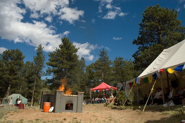 Preparation for an open air cremation at the private pyre at Shambhala Mountain Center. Photo by Corey Kohn