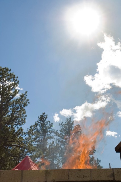 Open air cremation fire at the private pyre at Shambhala Mountain Center. Photo by Corey Kohn