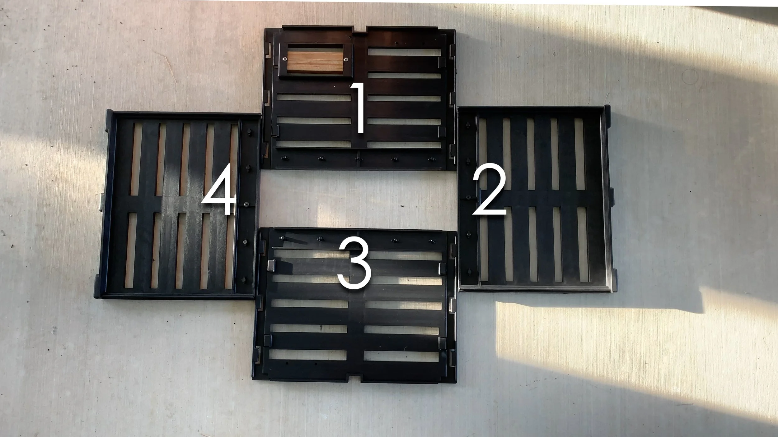 1. Side with wooden chew out window 2, Side with square tops facing out/up 3. Side with no square tops 4. Side with square tops facing out/up