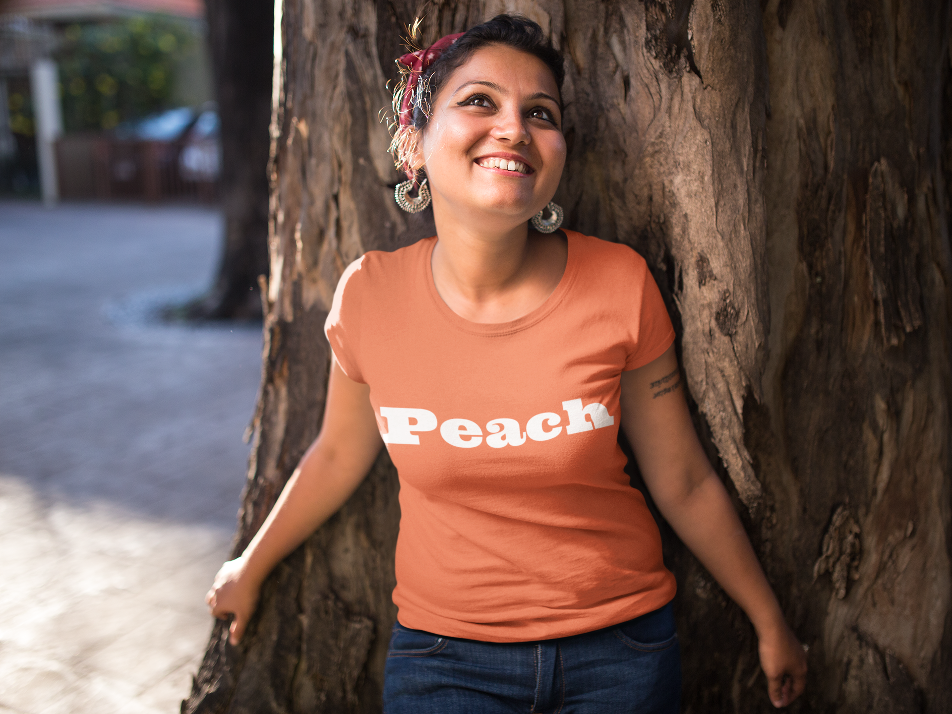 mockup-of-a-happy-girl-wearing-a-tshirt-against-a-tree-20571.png
