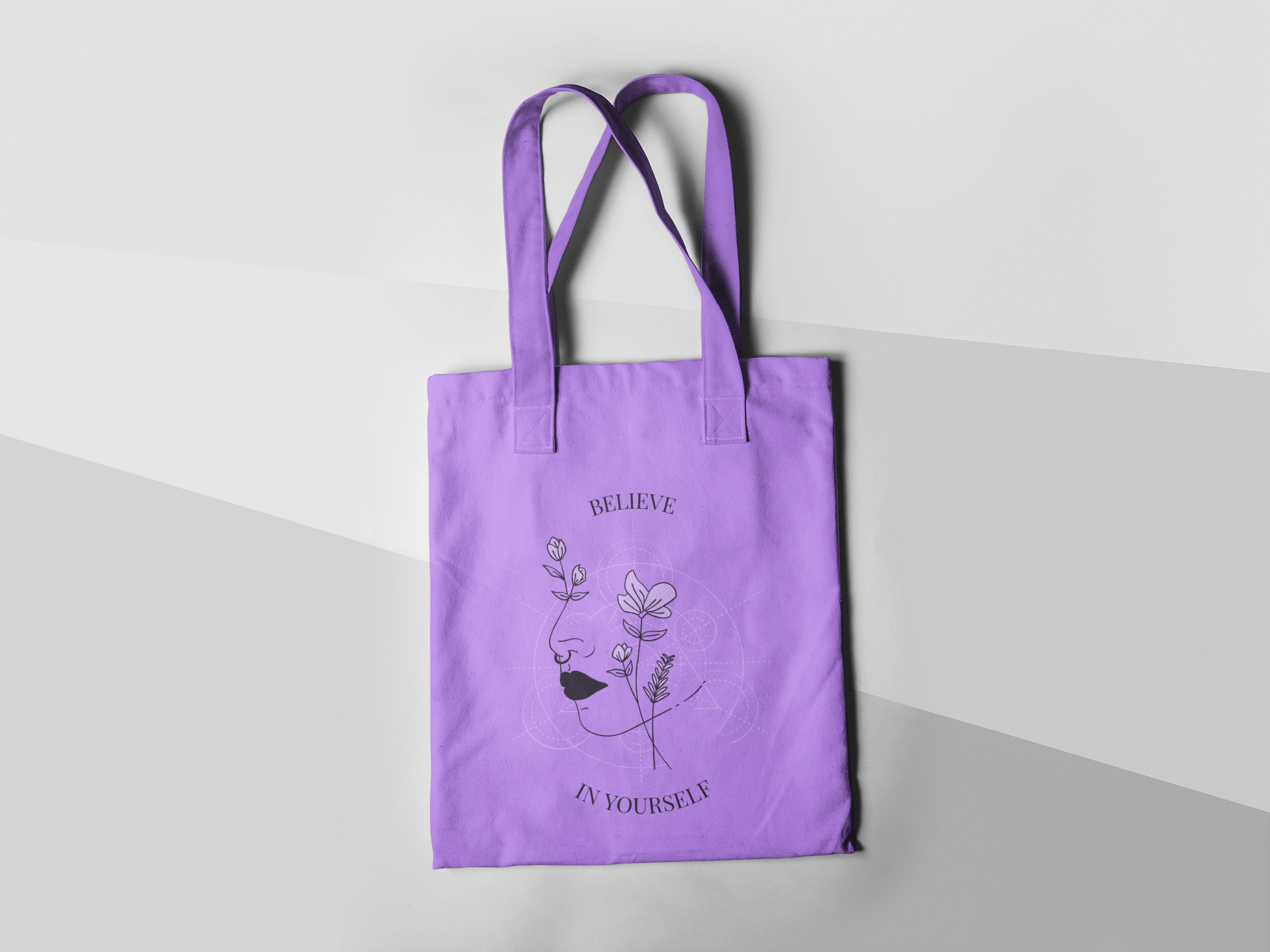 tote-bag-mockup-lying-on-a-three-colors-surface-a15312.png