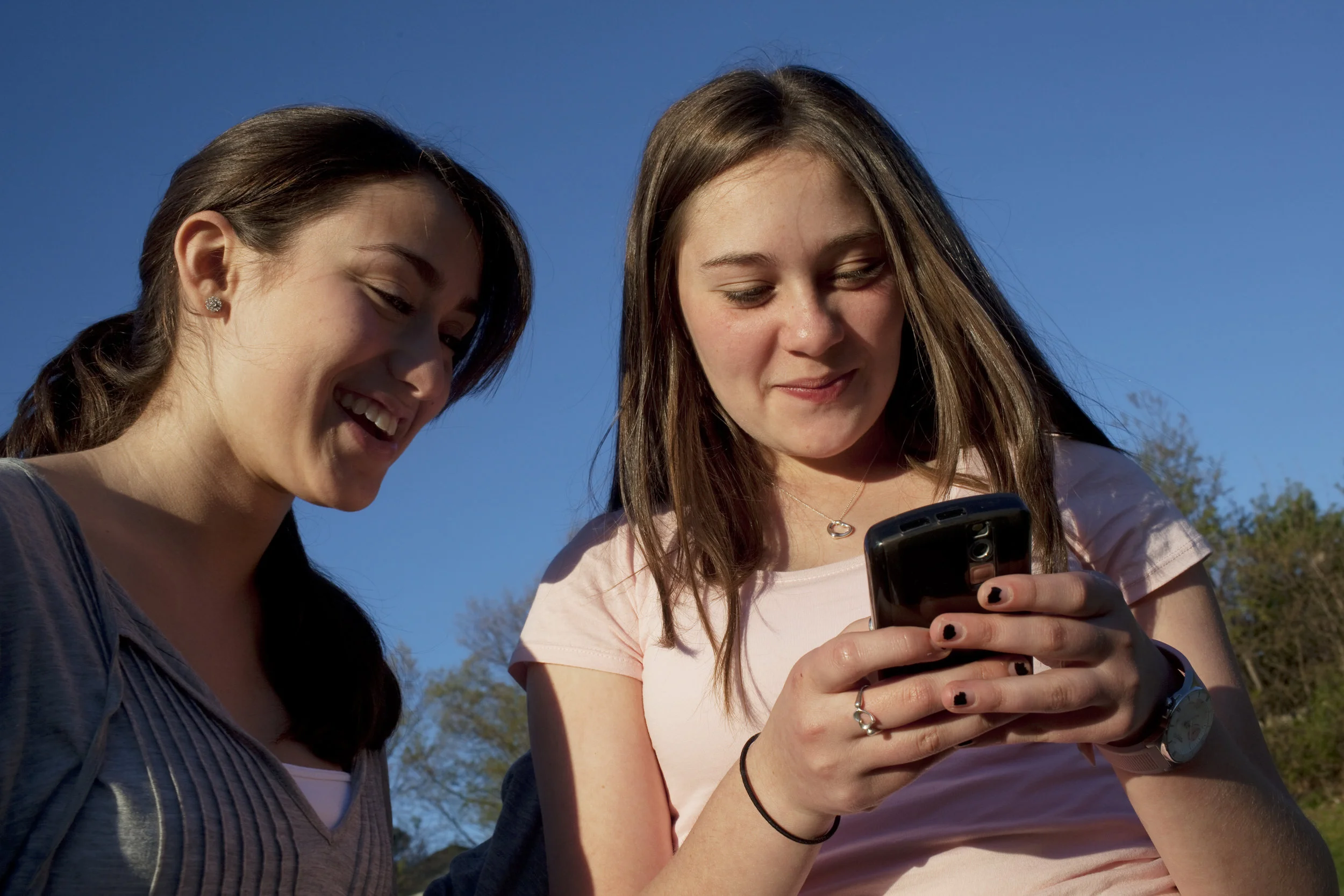Two Teenage Girls Playing with Phone.jpg