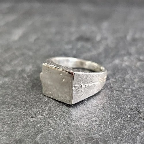 SAND CAST A SILVER SIGNET RING (