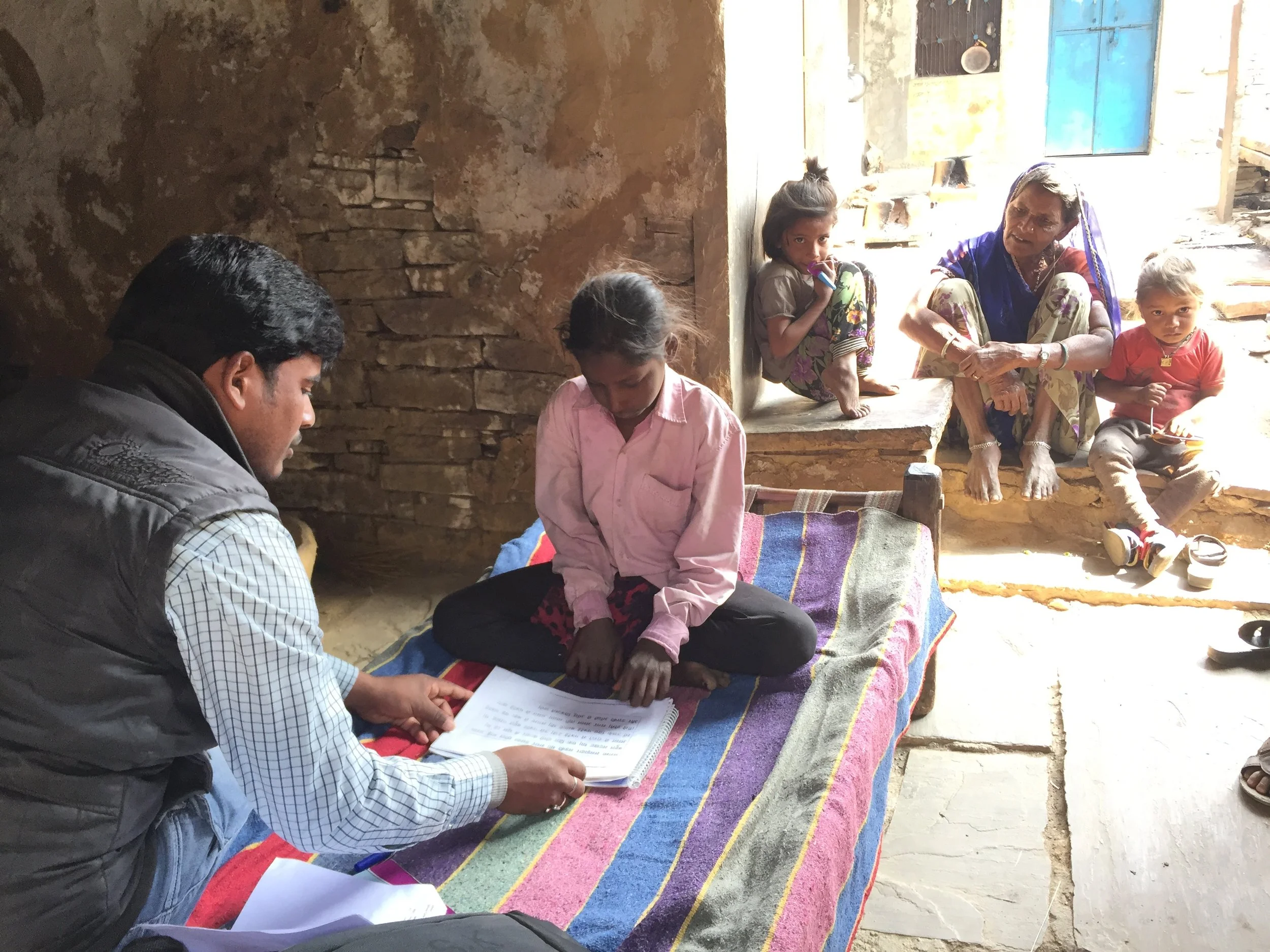 A school-aged girl in Bhilwara District completes the ASER assessment as part of the Educate Girls Development Impact Bond evaluation.