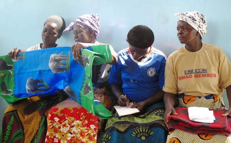Zambian mothers examine the contents in their “mama kits”.