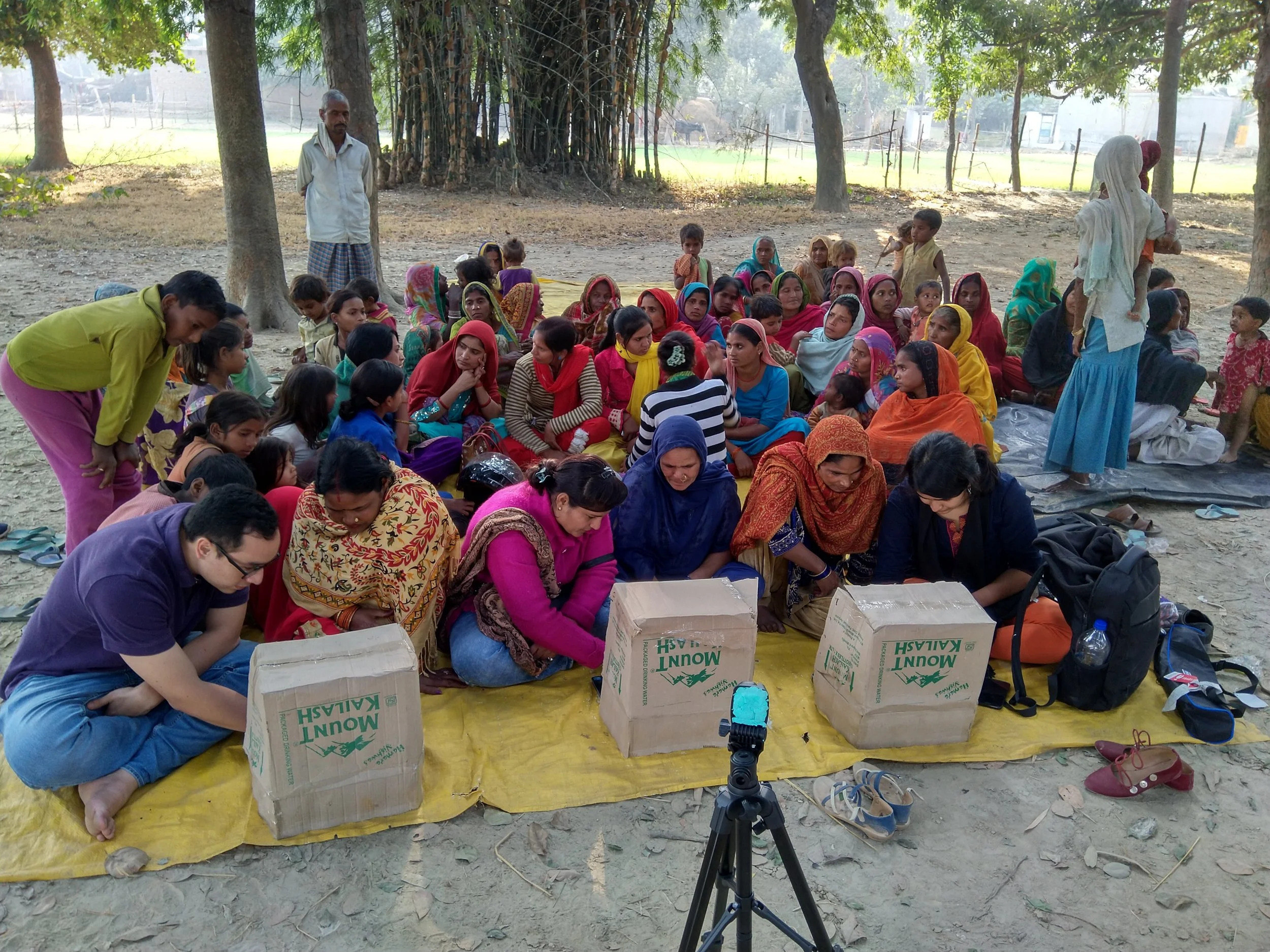 Women in Bahraich, Uttar Pradesh, guided by IDinsight Associates Andres Parrado and Ishita Batra, share their preferences on banking, savings, and loans as part of data collection.