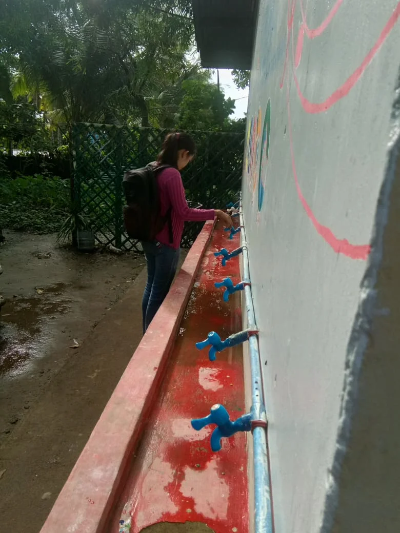 Camarines Norte Enumerator inspects handwashing facility4.jpg