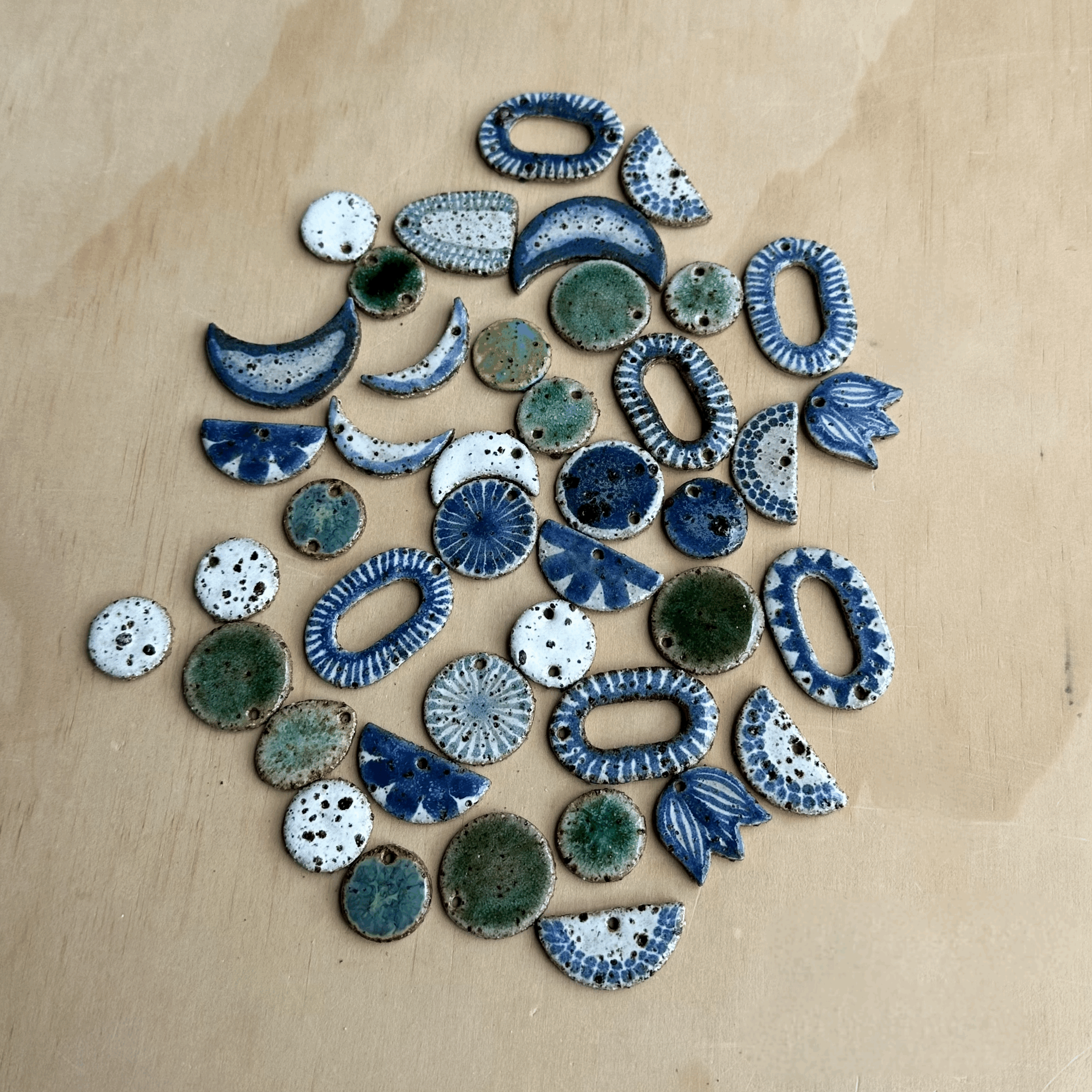 Pack of 40 Seconds Mixed Earring, Stud and Brooch Pieces - Brown Clay, Mostly Blue, Green & White Glaze (NEED SANDING)
