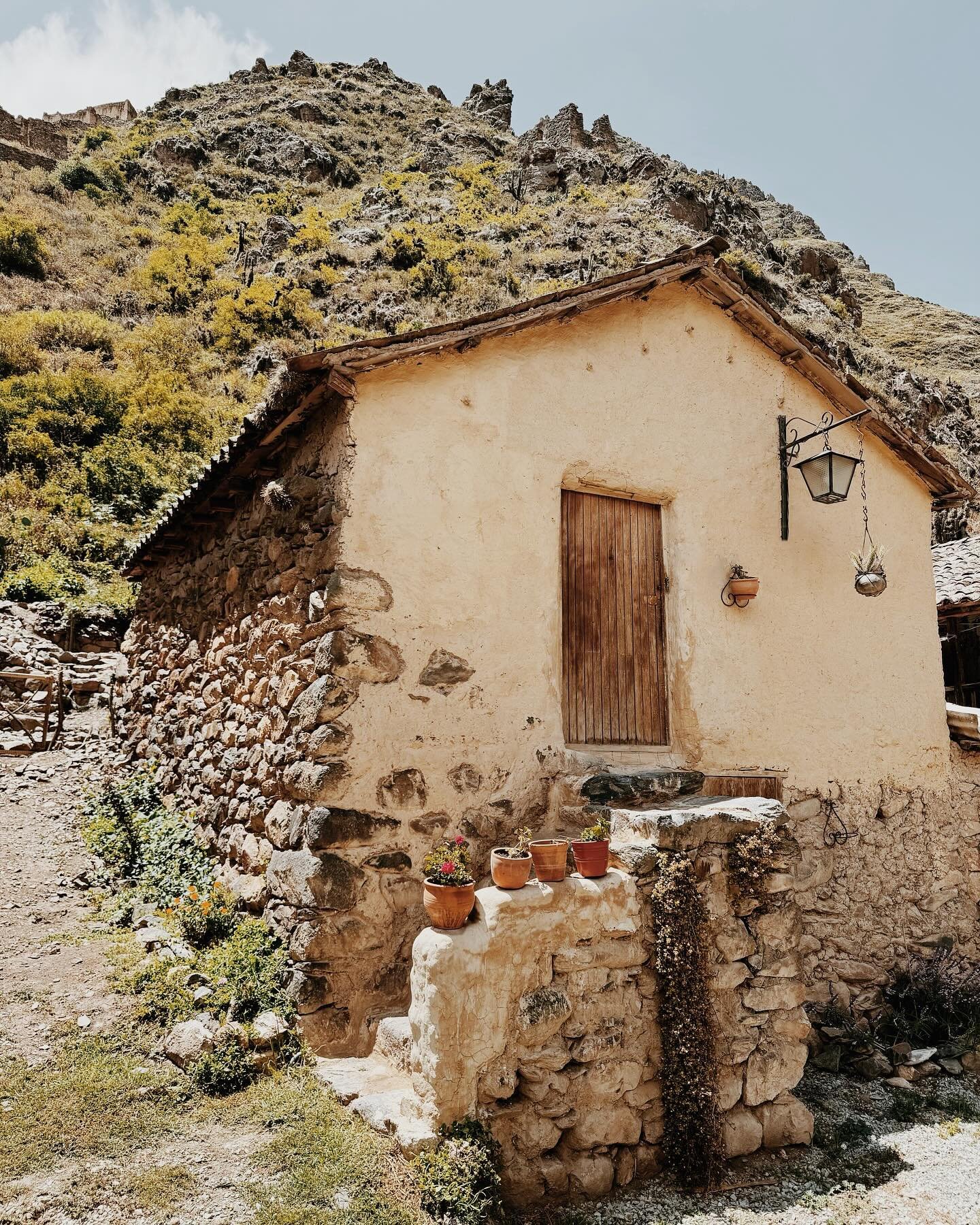 Will travel to the ends of the earth to stay in charming dwellings such as this: a two hundred year old corn drying atroje turned cottage nestled at the base of the sacred Apu Pinkuylluna mountains with Inkan ruins rising up behind. New world and old