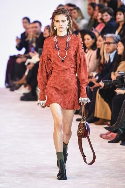 Shorter lengths are going to be important. This Chloe dress is great example of a shorter Autumnal dress. This could work with tights when the temperatures drop. Sheer tights are also set to make a come back worn with shorter lengths.