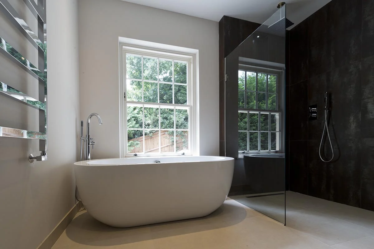 Deepdale bathroom with bath and shower